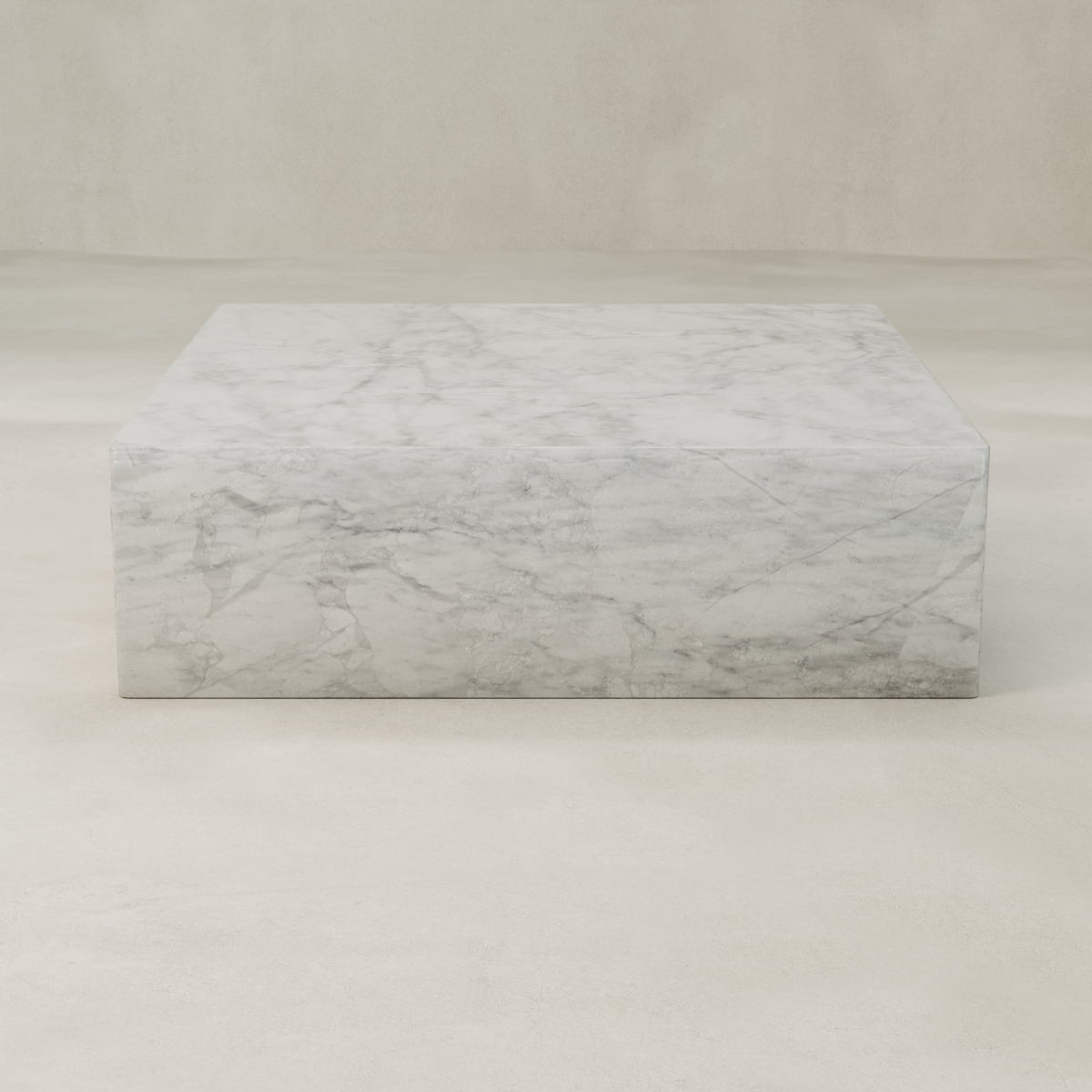 The Griselle Marble Coffee Table XL features elegant, refined white marble with graceful grey veining, all showcased against a plain, light-colored background.