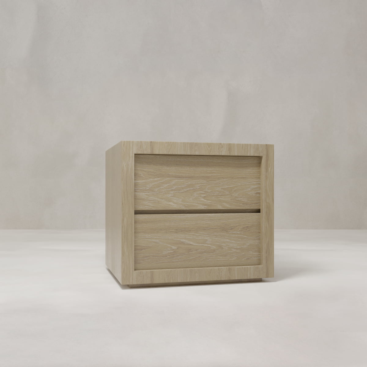 The Henley Nightstand features a light oak finish with two drawers, showcased on a pale surface against a neutral textured backdrop.