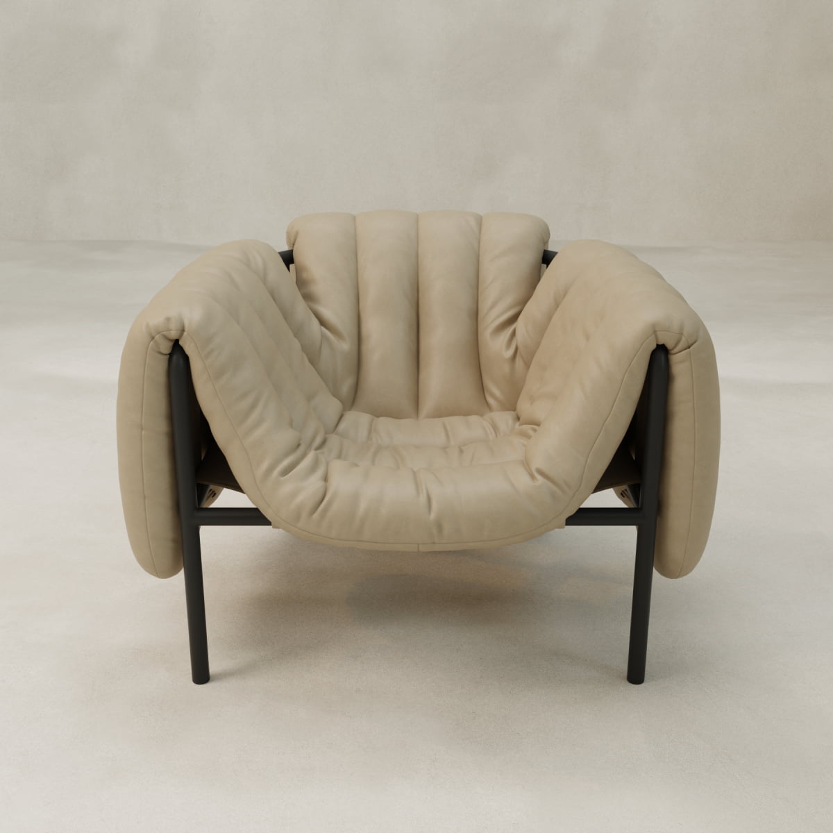 The Mallow Chair is a modern, plush beige seat with deep, soft cushions, black metal legs, and channeled tufting, shown against a light minimalist background.
