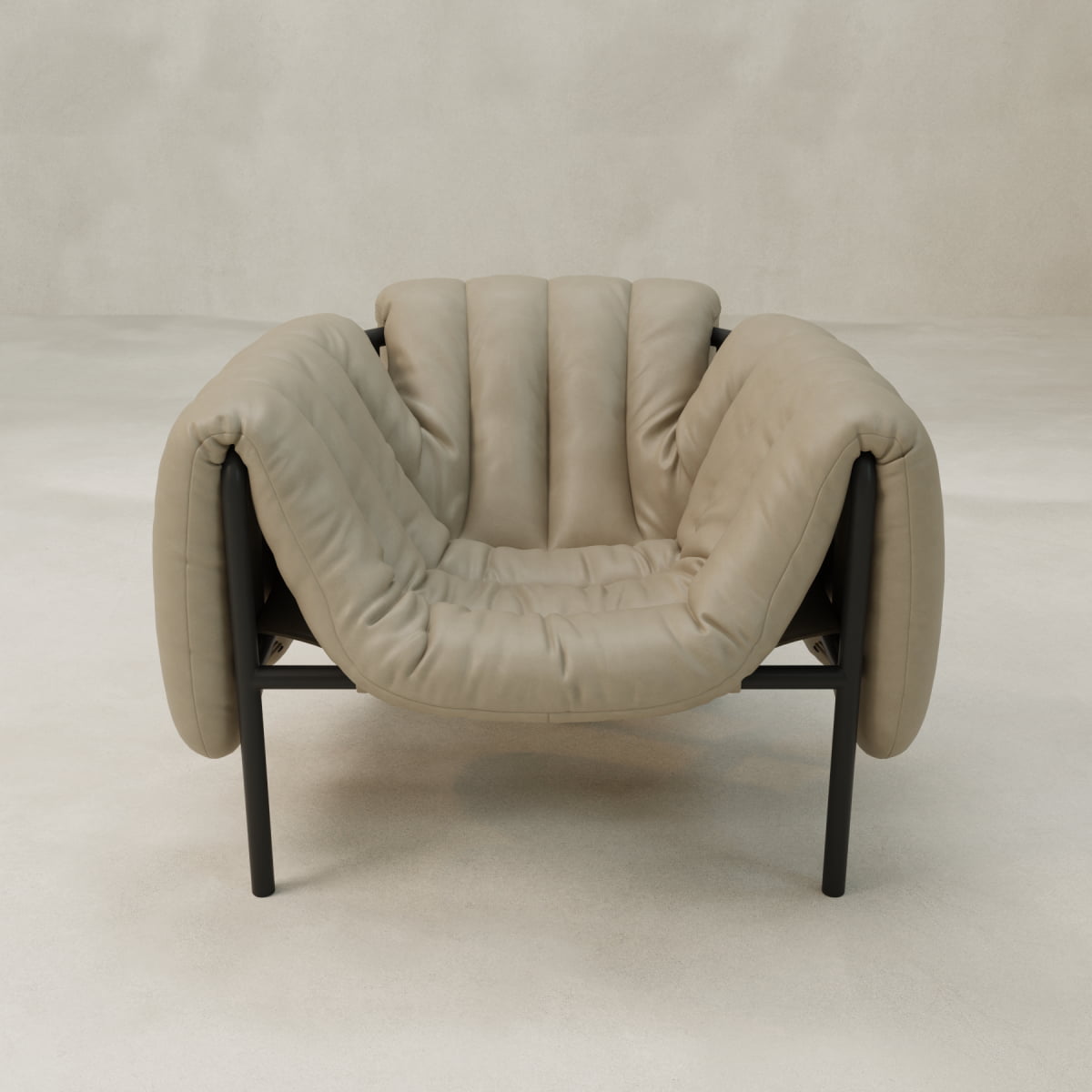 The Mallow Chair features plush, soft light beige upholstery, deep channeled tufting, black metal legs, and a modern minimalist design, set against a light neutral background.