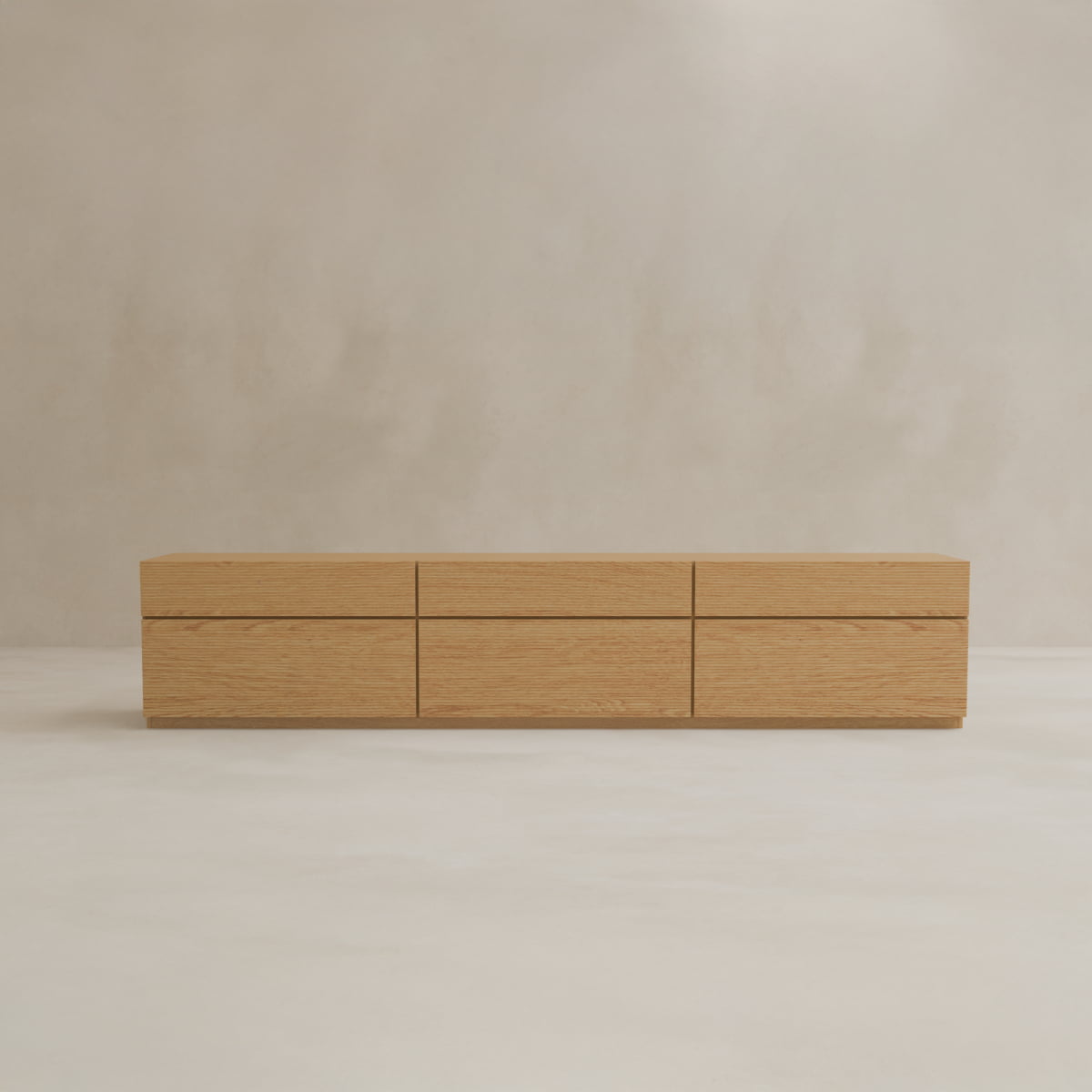 The Oster Media Console is a modern, minimalist wooden sideboard with six discreet drawers. Its low, rectangular design is showcased against a plain, light beige background.
