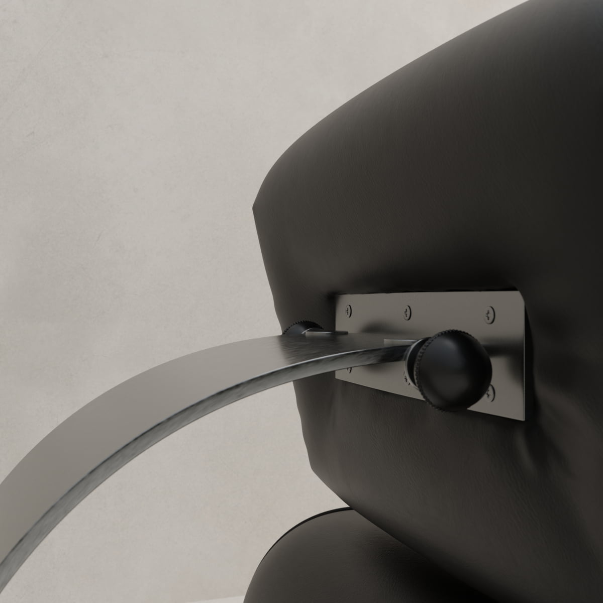 Close-up of the Paolo Chair With Ottoman’s black leather backrest, highlighting a metal support bracket with dual round knobs, displaying a chic design against a plain light background.