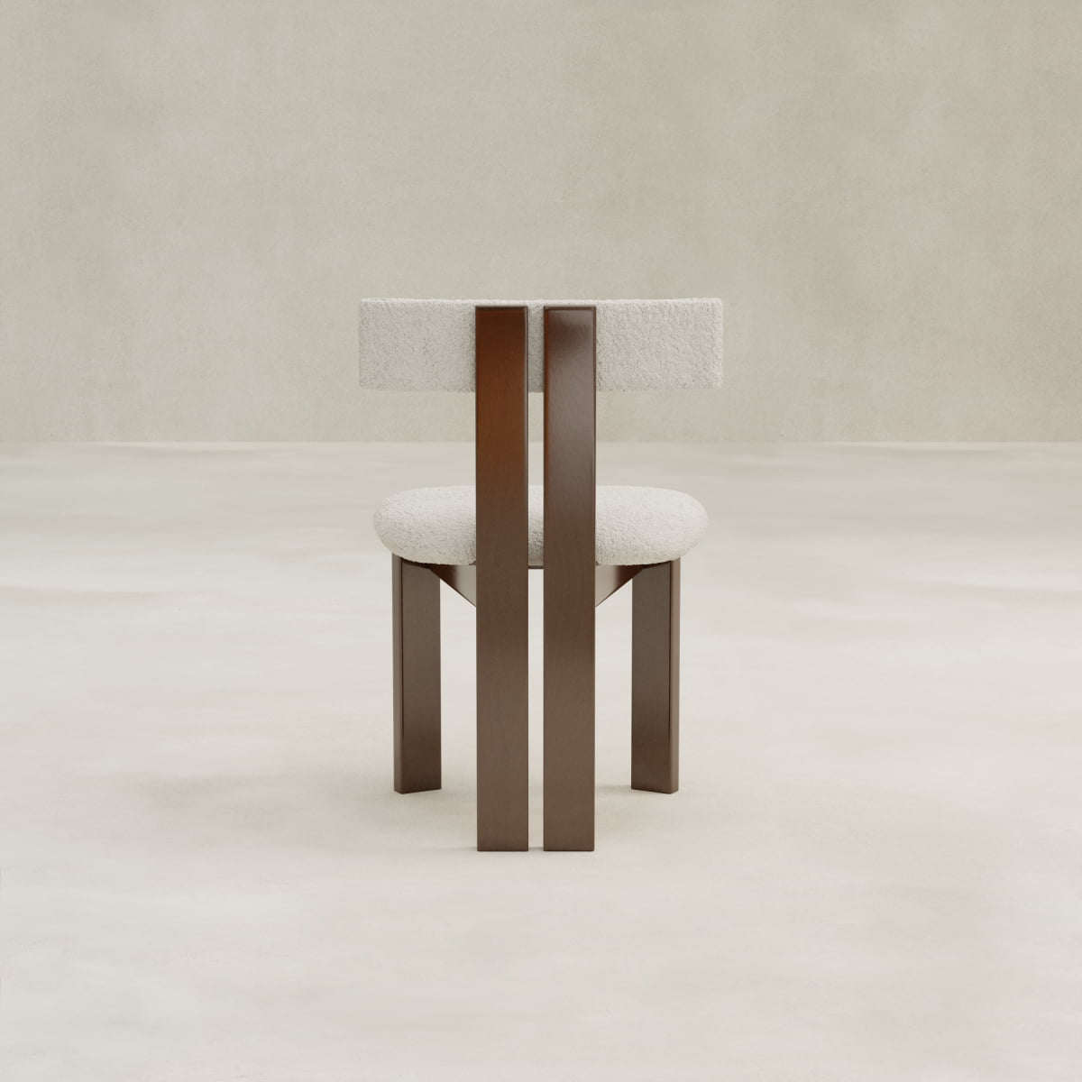 The Radley Dining Chair features a round, upholstered seat and backrest in light bouclé fabric, supported by three vertical wooden legs. Its modern design and minimalist style offer enhanced comfort in any dining space.