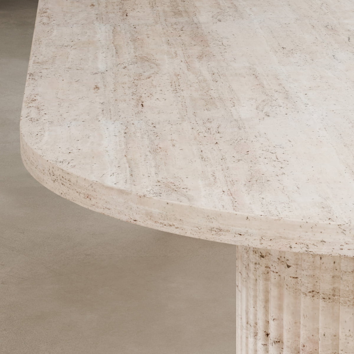 Close-up of the Richmond Table—a light beige Travertine dining table with a rounded edge and fluted cylindrical base, highlighting natural stone texture and veining. A sculptural statement piece for any space.