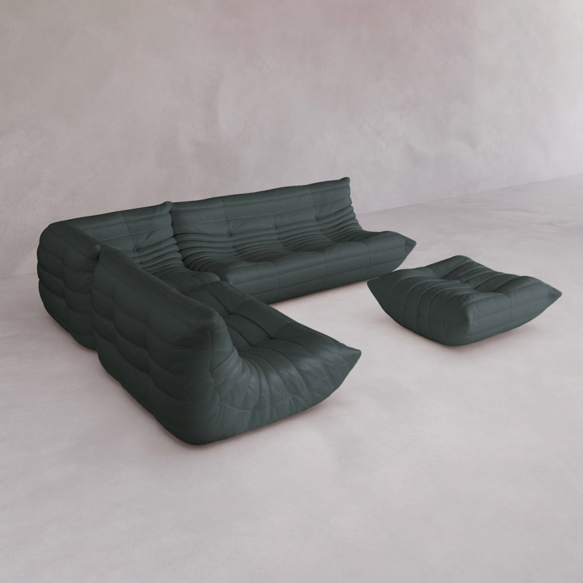 The Rolo Lounge Four Piece Sofa, featuring tufted upholstery in modern dark green, is paired with a matching ottoman on a minimalist light floor against a pale wall, capturing the sleek look of mid-century design.