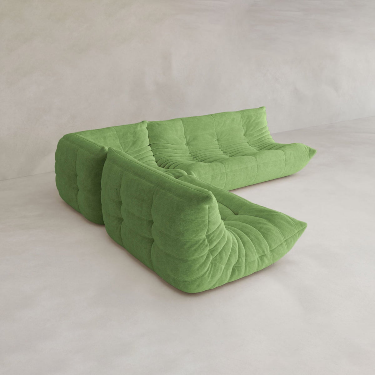 The Rolo Lounge Three Piece Sofa is a modern, mid-century-inspired green sectional with deep tufting and hidden legs, arranged in an L-shape as a versatile modular system on a neutral, minimalist background.