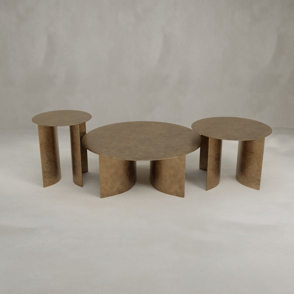 The Set of Roma Tables features three modern round tables with a bronze finish and sculptural legs—a large central table and two smaller side tables—to bring sophisticated style to your decor.
