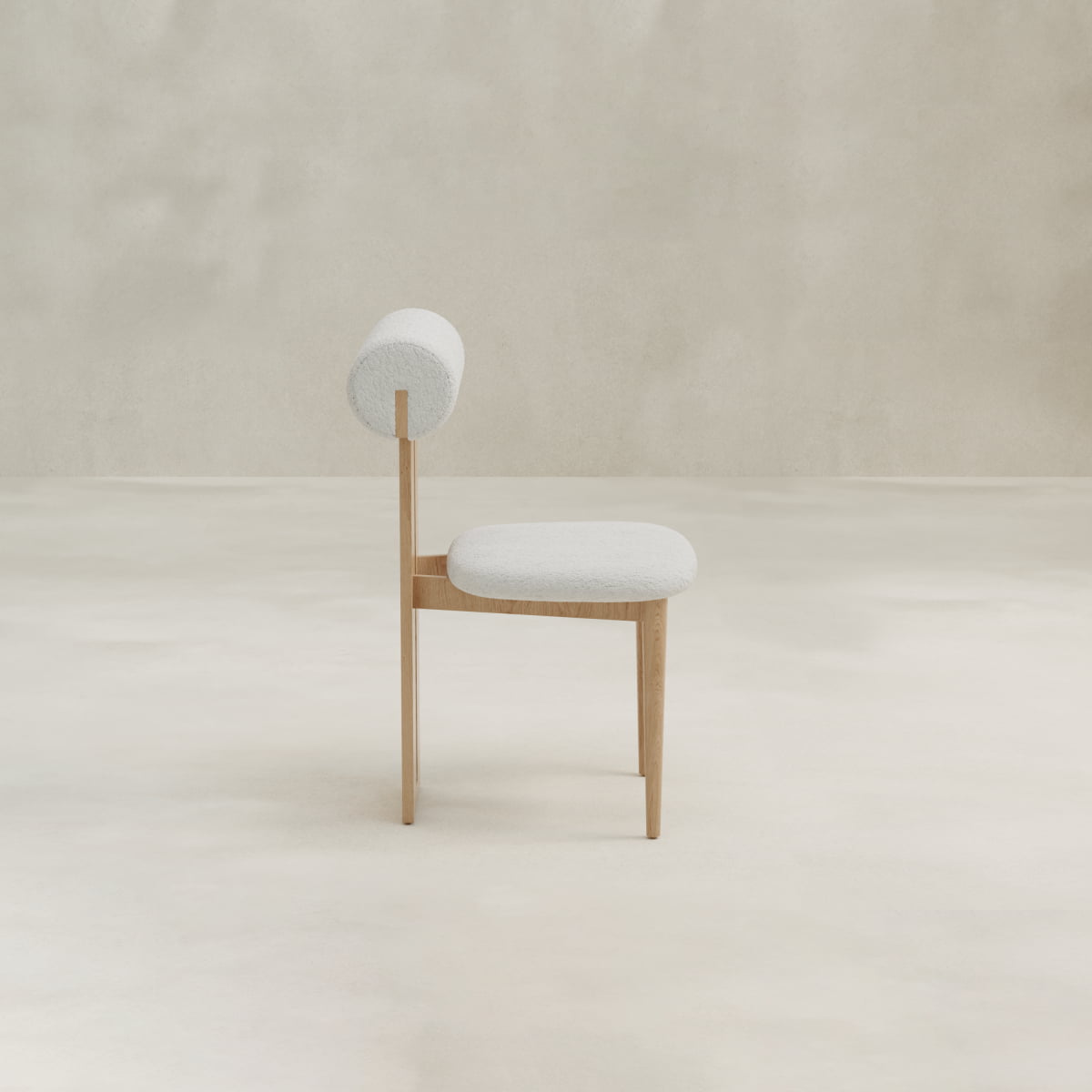 The Renè + Templeton Dining Set features a modern minimalist chair with a round backrest and light fabric, paired with a travertine pedestal-base dining table, perfect for a neutral-toned room.