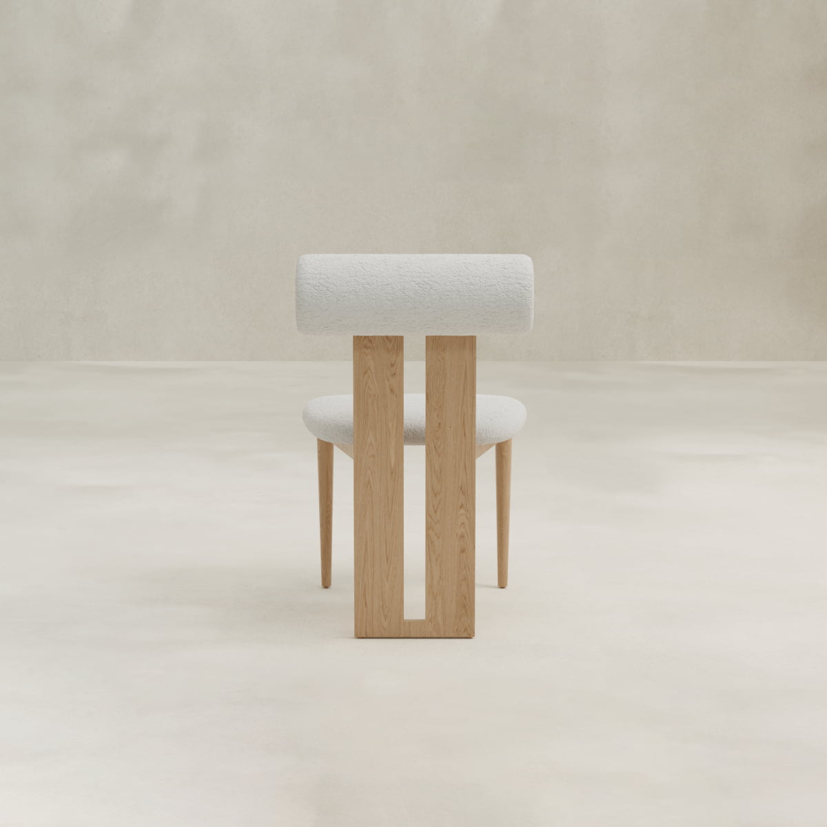 The Renè + Templeton Dining Set features minimalist chairs with wooden frames, white upholstered seats, and cylindrical backrests—perfectly pairing with bouclé dining chairs in a neutral room with light floors and walls.