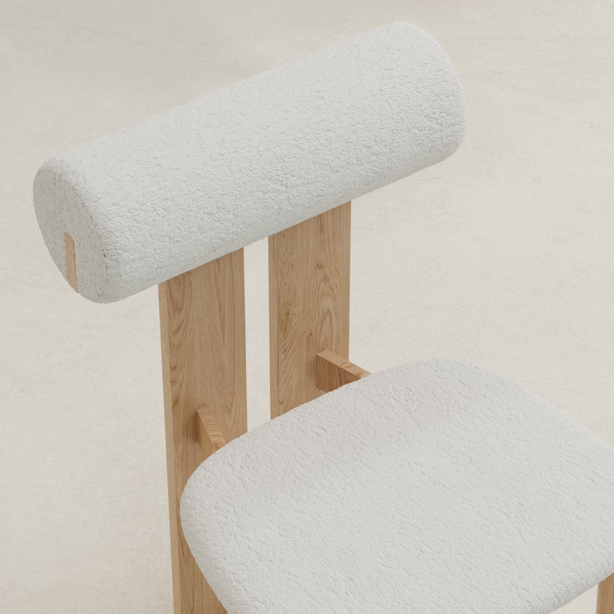 The Renè + Templeton Dining Set features a modern chair with a cylindrical, textured white backrest and seat, both supported by light wooden legs, evoking the style of bouclé dining chairs against a neutral backdrop.