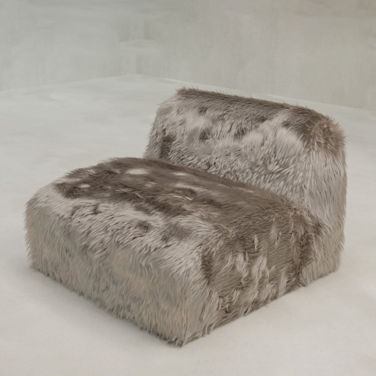 The Yeti One Seater Modular, featuring armless design and shaggy gray faux fur upholstery, sits on a minimalist floor—an ideal accent for contemporary living spaces.