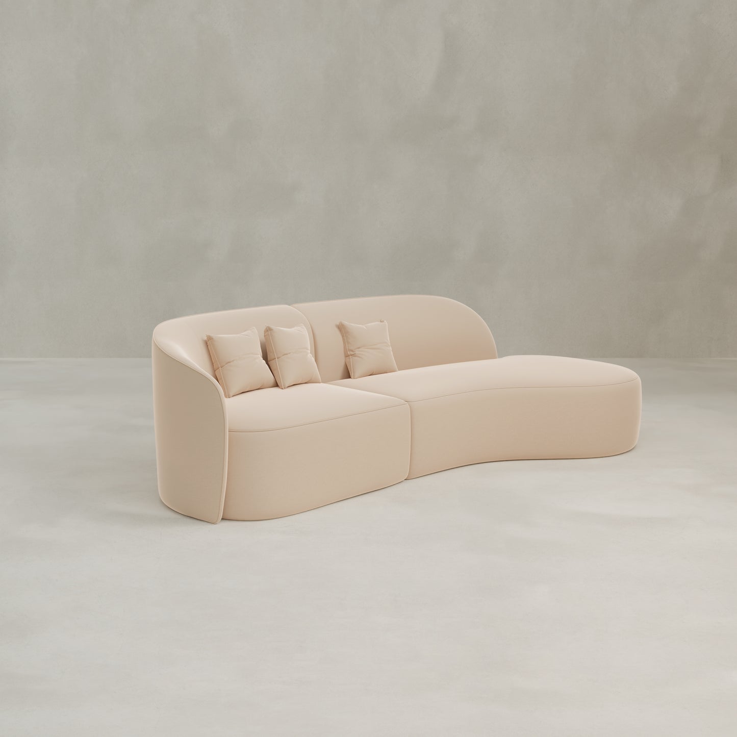 The Marlow Curved Modular Three Seater Sofa features luxurious light beige upholstery and three matching square cushions, showcased against a plain light gray background.