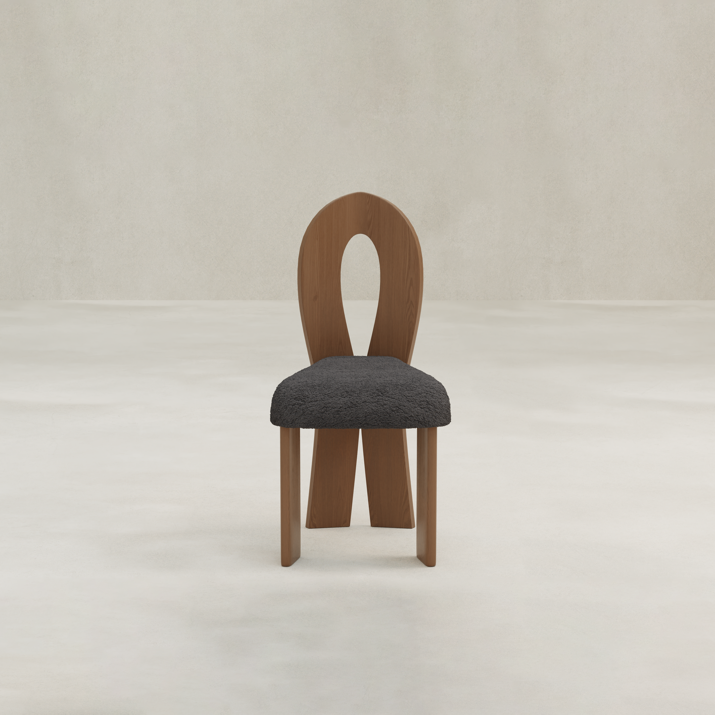 The Aveline Dining Chair features a modern design with an oval cutout backrest and a black textured seat cushion, shown against a light, plain background.
