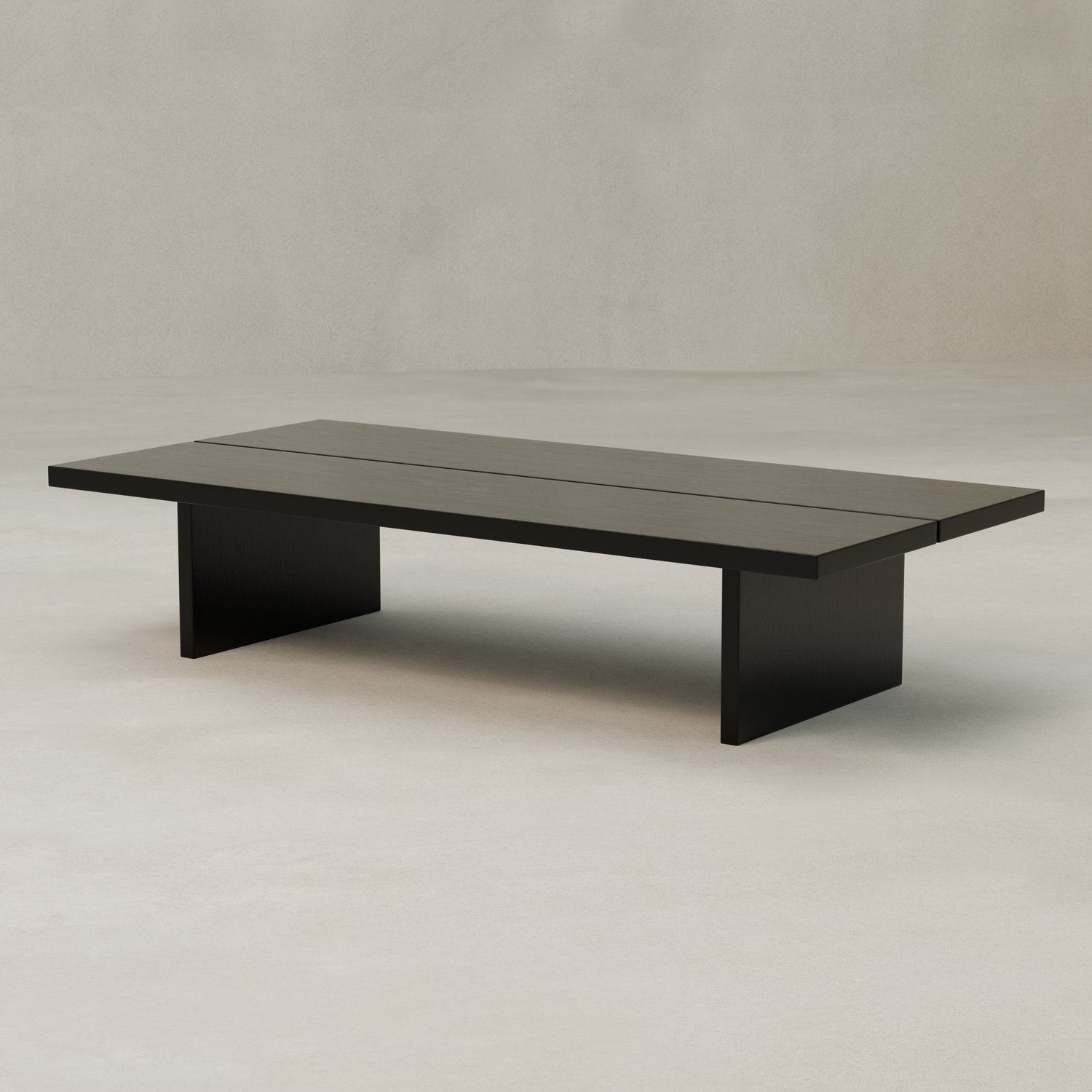 The Bastion Coffee Table is a minimalist, rectangular piece made from solid pine with a flat top and two wide slab legs, set against a neutral background for subtle rustic charm.