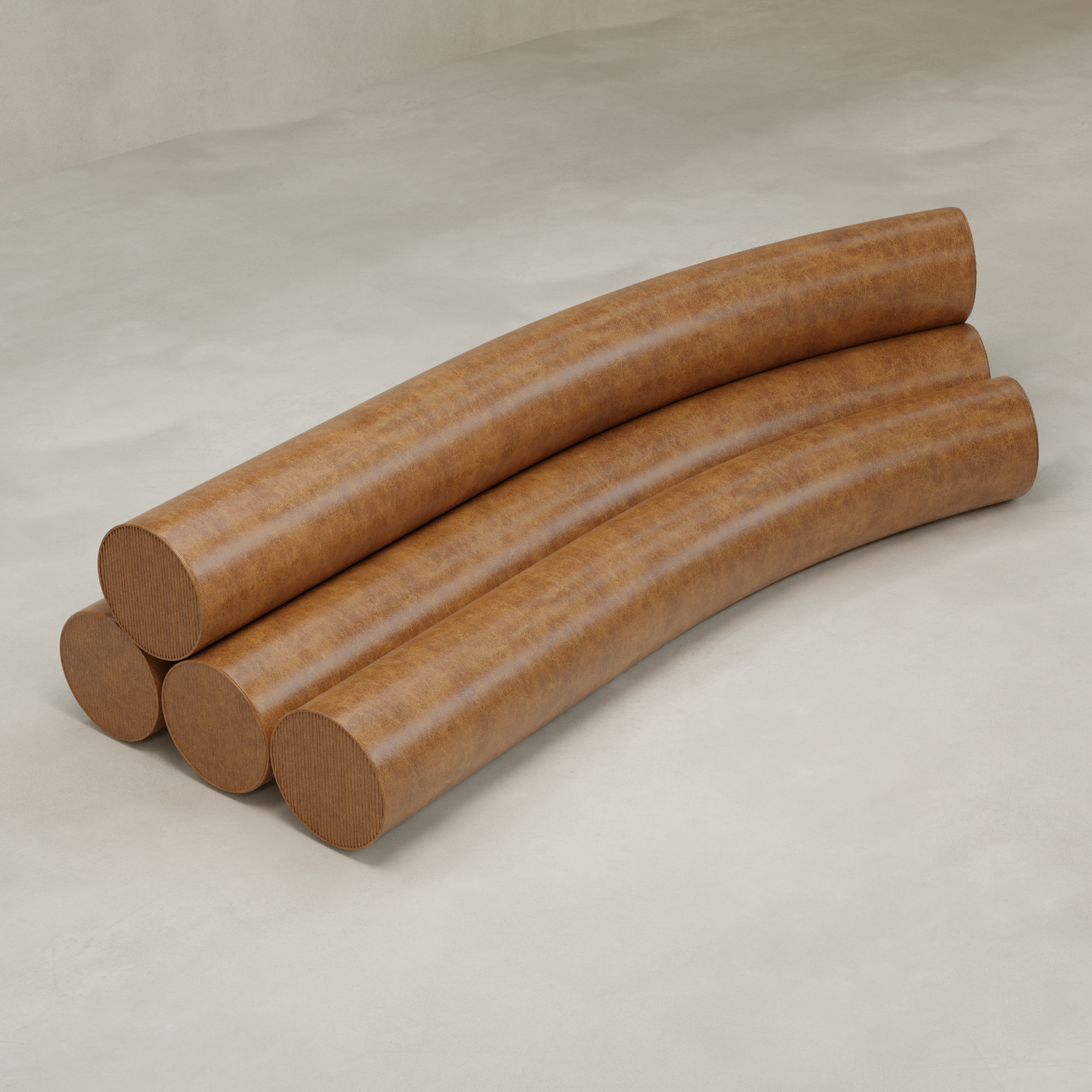 Four large, cylindrical brown Cylindra Sofa pieces with a leather-like texture are stacked in two layers on a smooth, light-colored floor, forming a gentle arch shape.