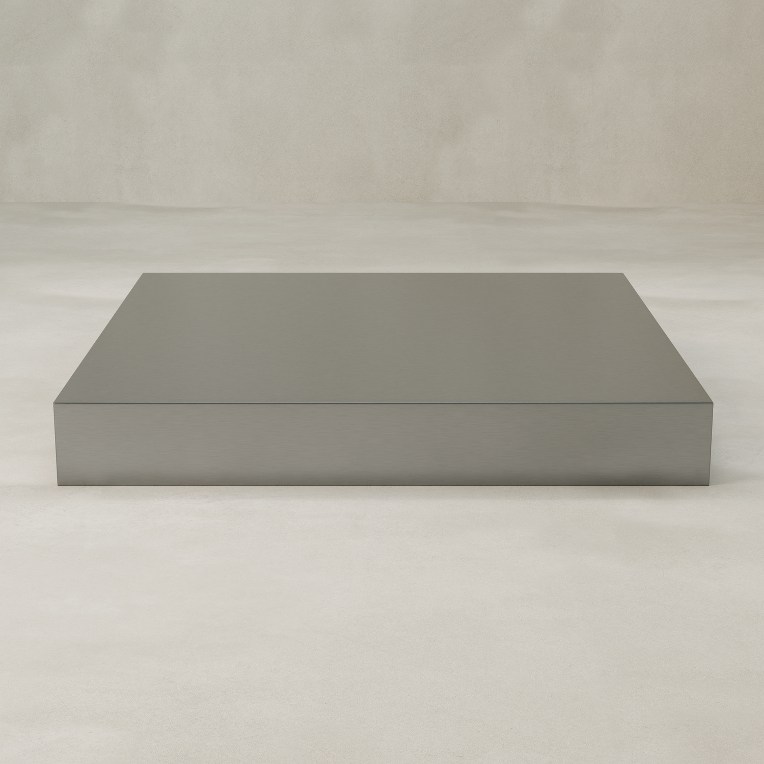 The Forge Steel XL Square Plinth, featuring a minimalist rectangular design, sits on a light floor against a textured neutral wall, introducing subtle industrial style to the space.