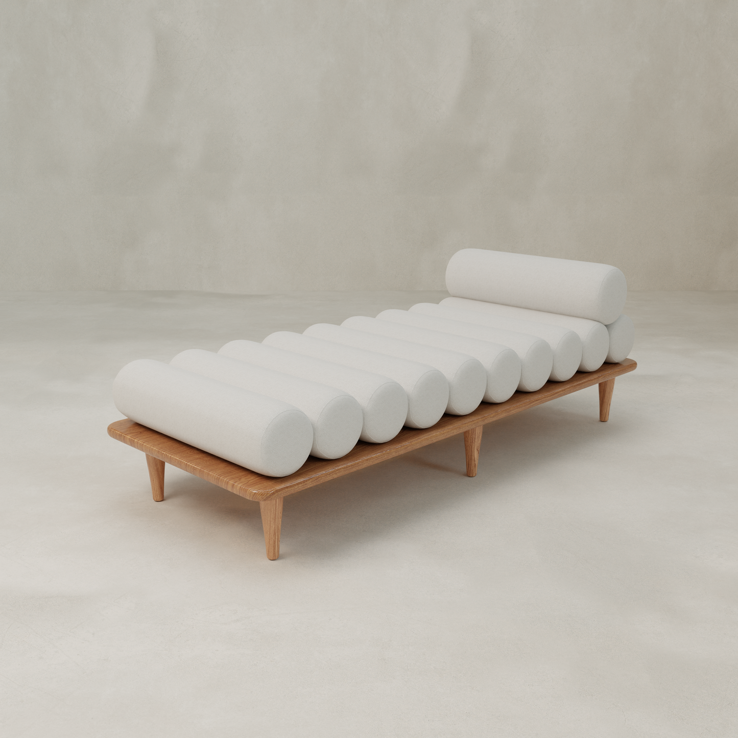 The Kingston Daybed features a modern design with cylindrical white cushions arranged horizontally, showcased against a light, minimalist background.