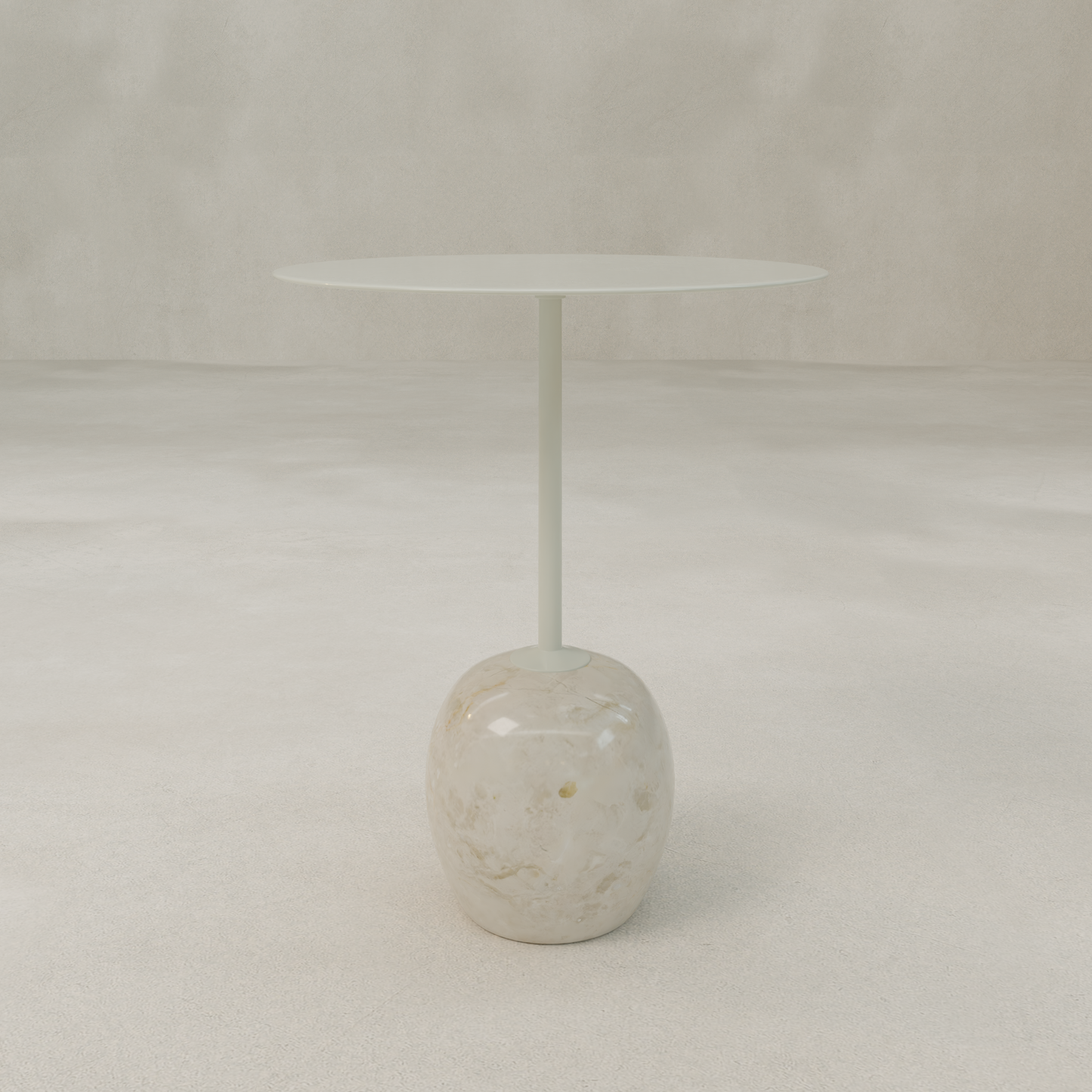 The Le Folie Table Crema Tall is a contemporary round tea table with a slim top and single central stone leg, supported by a marble-like rounded base, displayed against a plain, light-colored background.