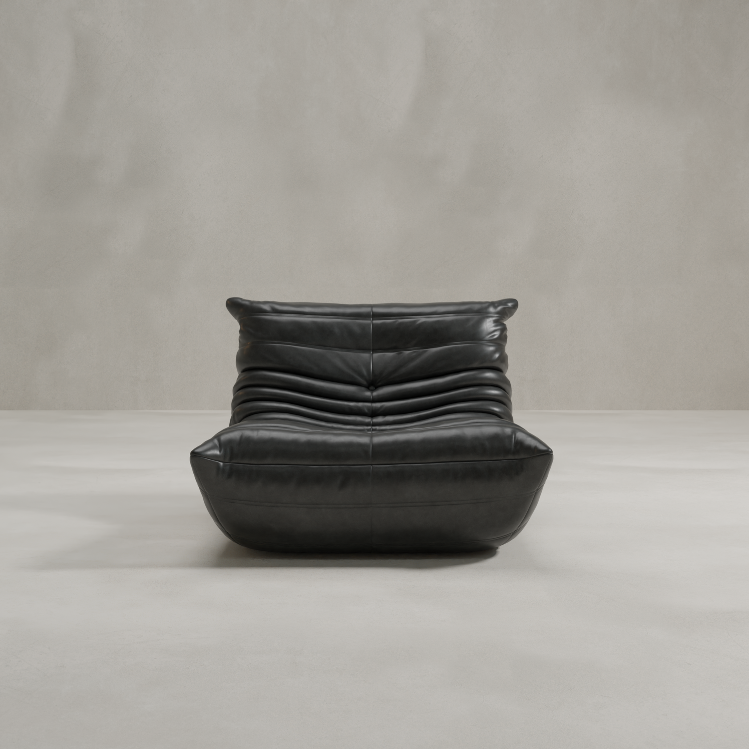 The Rolo Lounge Chair is a modern black leather lounge chair with a low, wide seat and horizontal pleats inspired by classic mid-century design, shown against a light gray background.