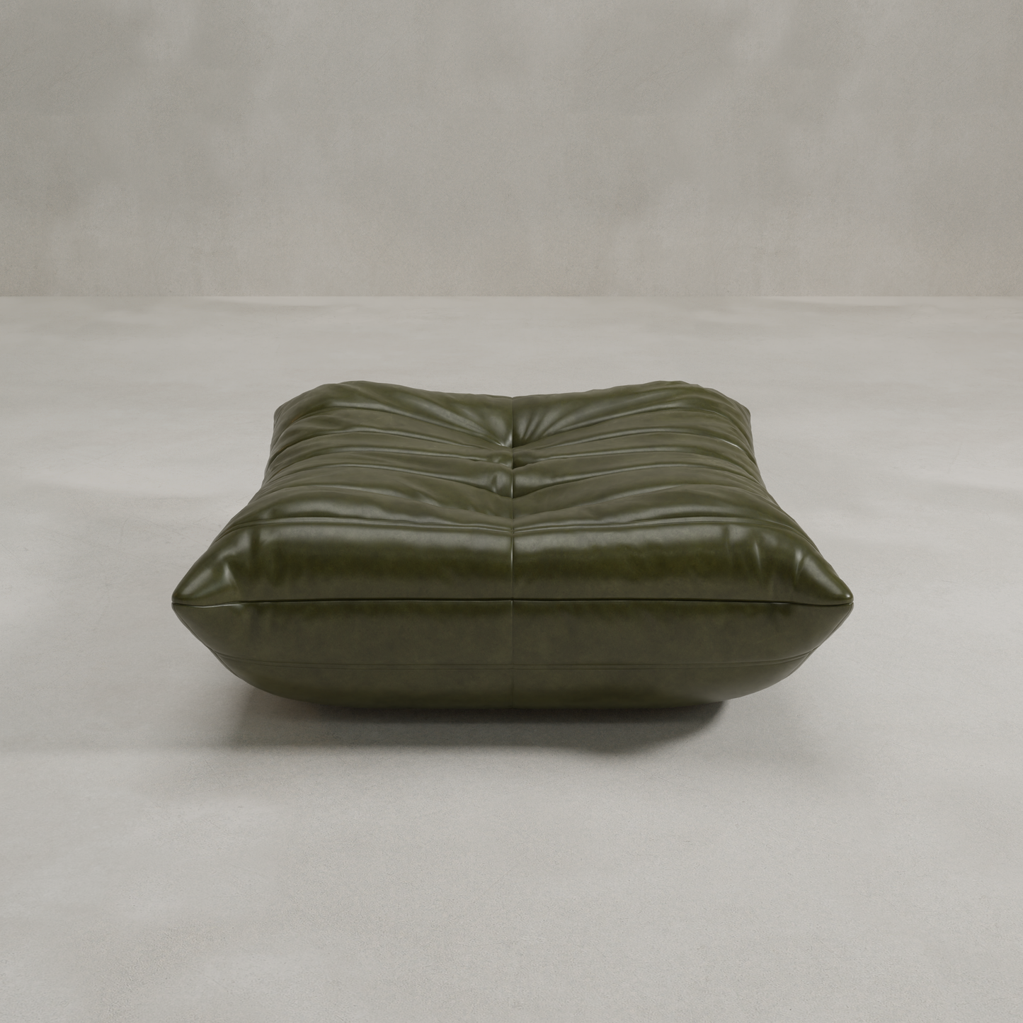 The Rolo Ottoman is a low, square ottoman in olive green leather with stitched tufting, ideal as extra seating or a versatile footstool. Shown on a light gray floor against a plain, light wall for modern style.