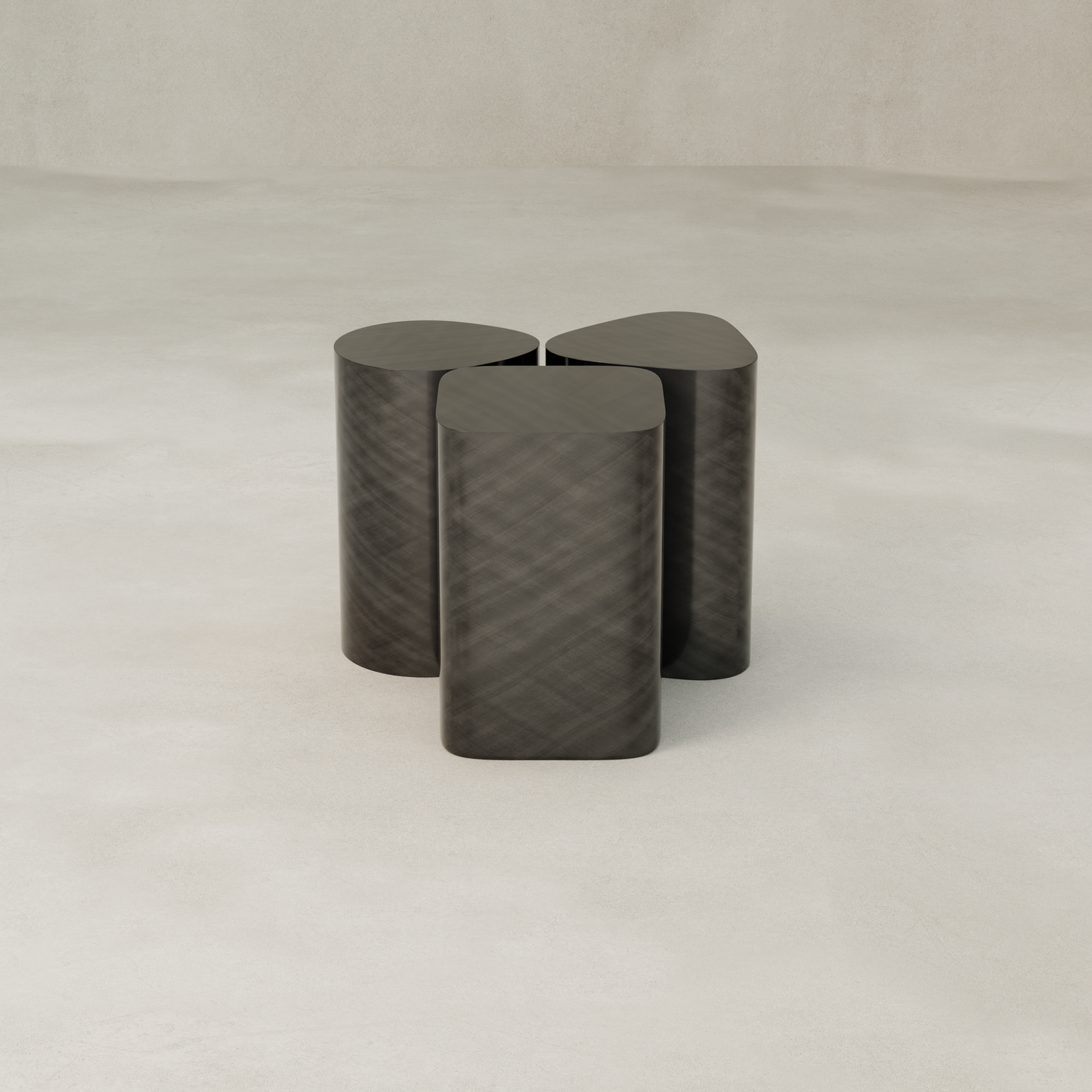 The Set of Solaris Side Table features a minimalist design with dark metal, three rounded rectangular legs meeting at the center, and stands on a smooth, light surface against a neutral background—exemplifying modern luxury.