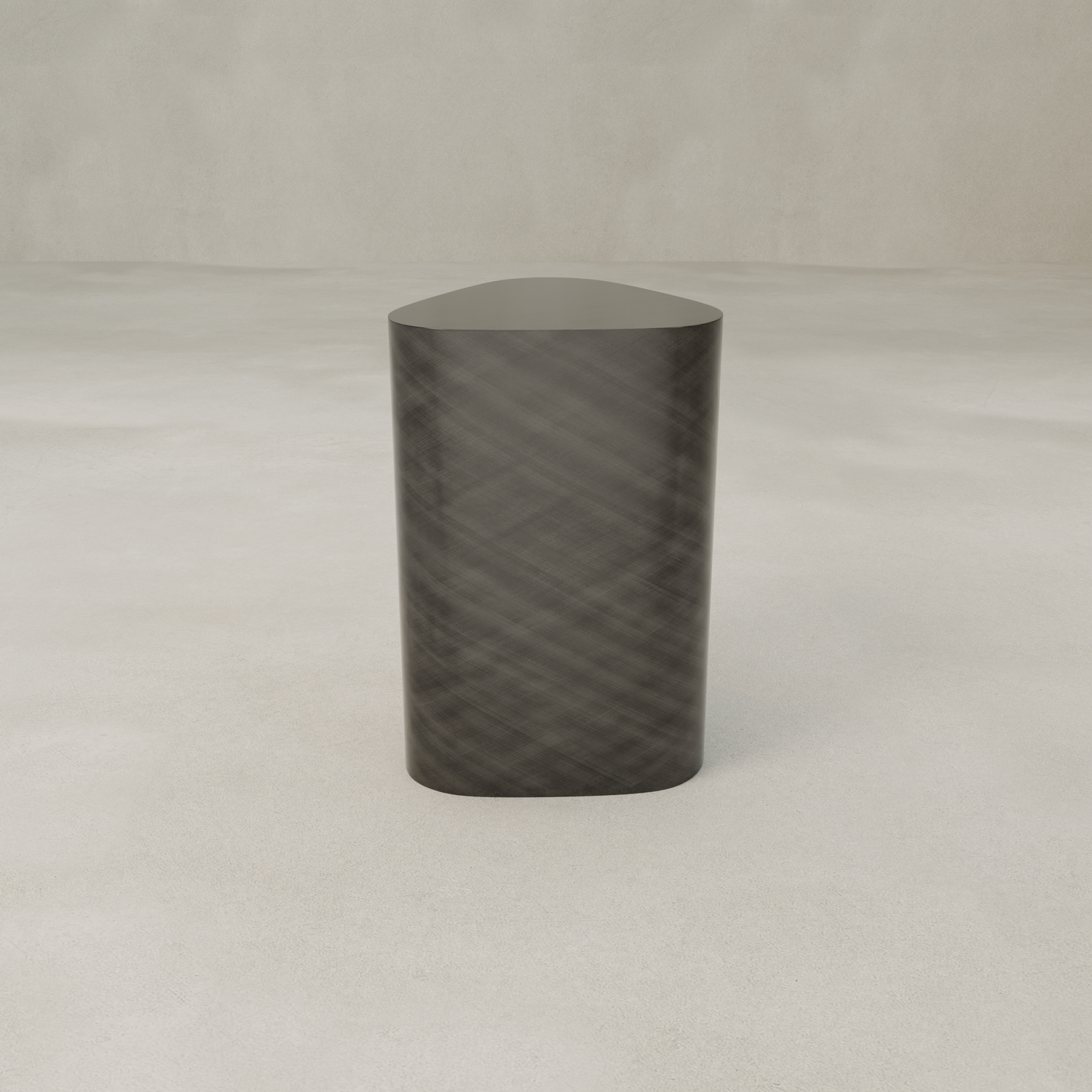 The Solaris Side Table Triangle, a dark modern luxury pedestal with a rounded triangular top, stands on a light textured floor against a plain beige background—ideal for fans of minimalist design.