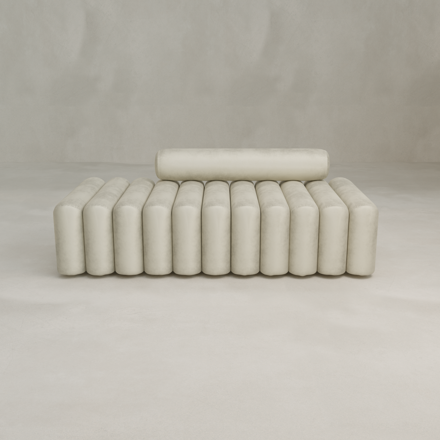 The Sonorra Bench Large features a modern, minimalist design in cream quilted velvet with cylindrical cushions—vertically upholstered on the seat and horizontally on the backrest—set against a plain, light background.