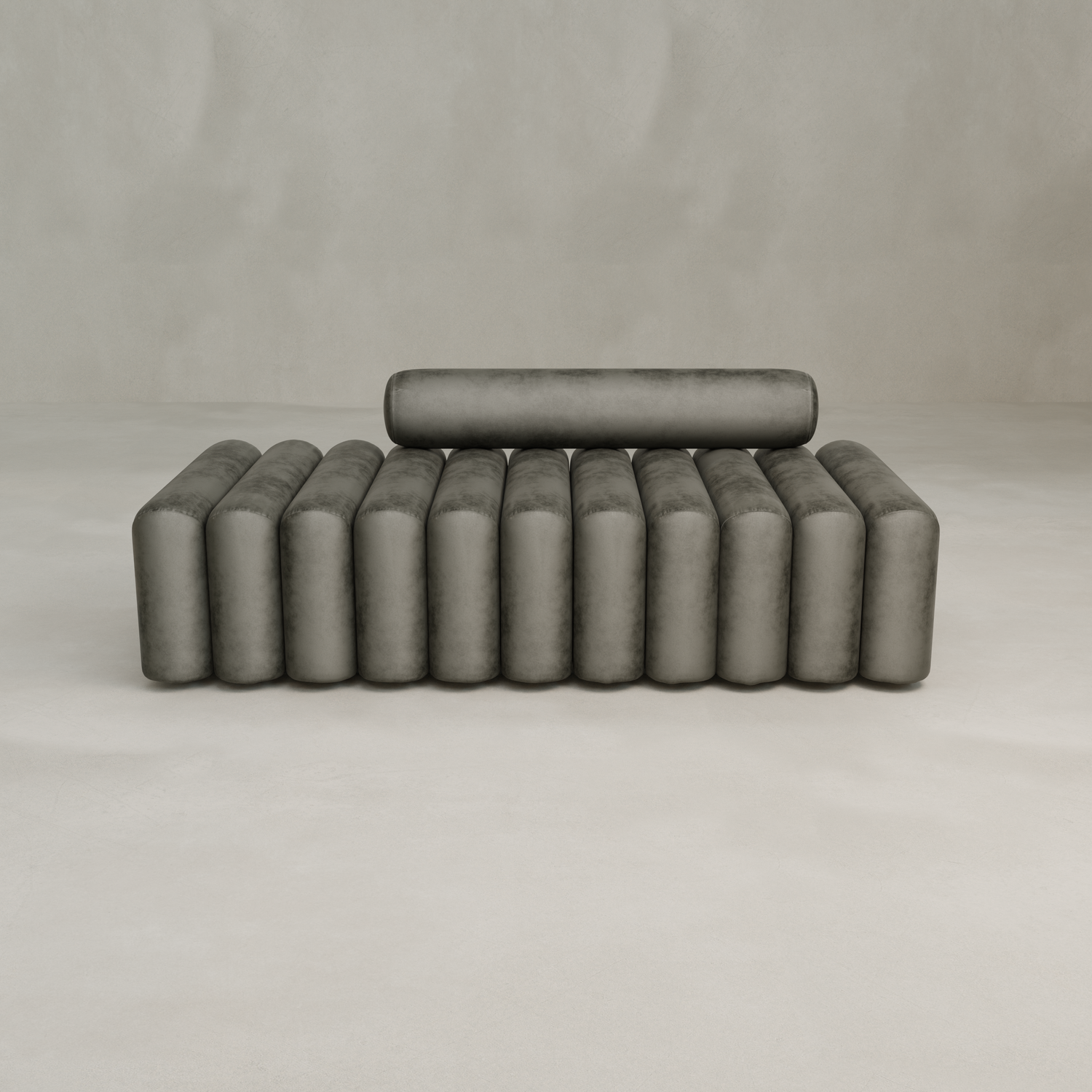 The Sonorra Bench Large features a modern cylindrical, ribbed design in gray quilted velvet with a matching backrest, shown against a plain light-colored background.