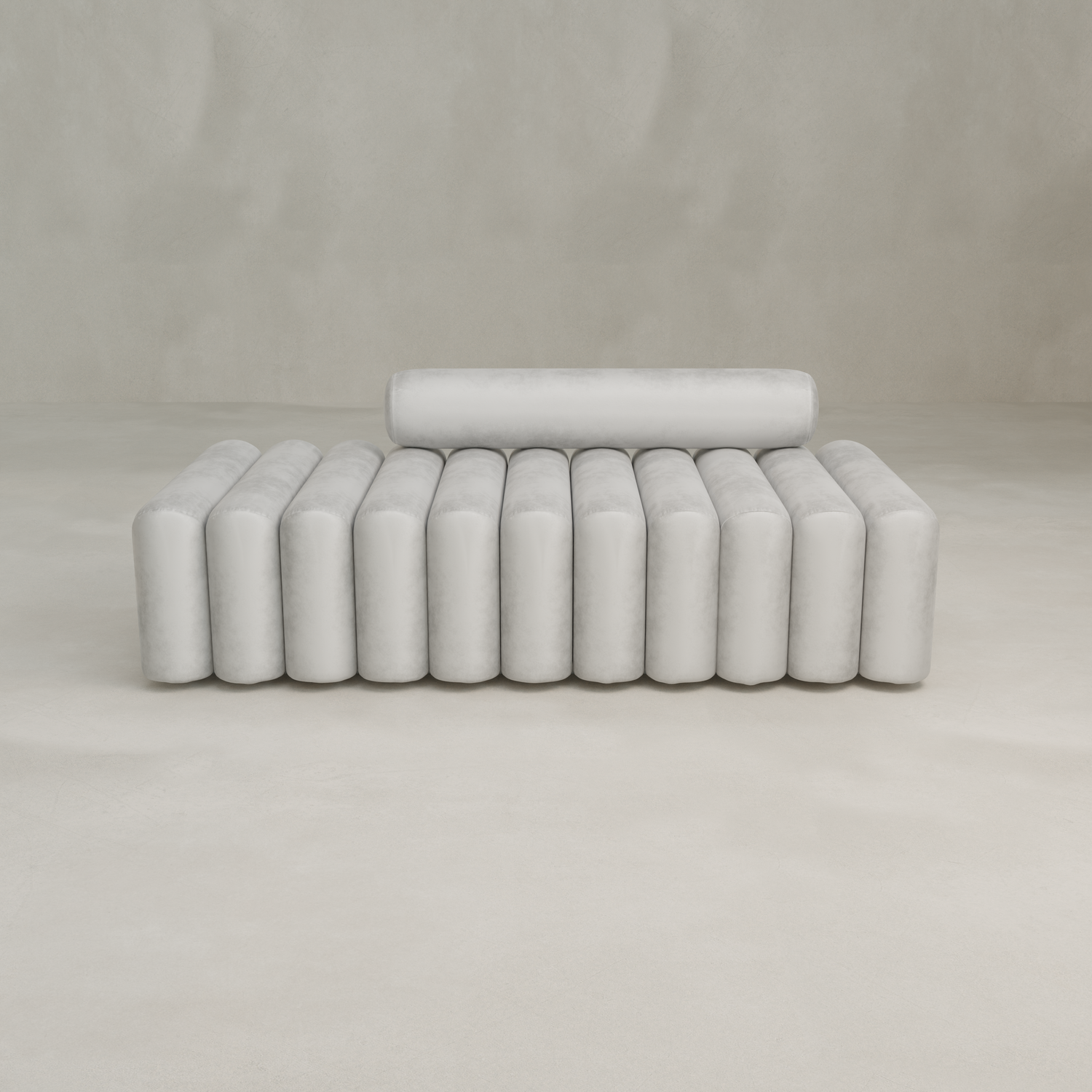 The Sonorra Bench Large is a modern, minimalist white bench featuring cylindrical cushions for the seat and a single matching bolster as the backrest, offering sleek contemporary seating against a plain light background.