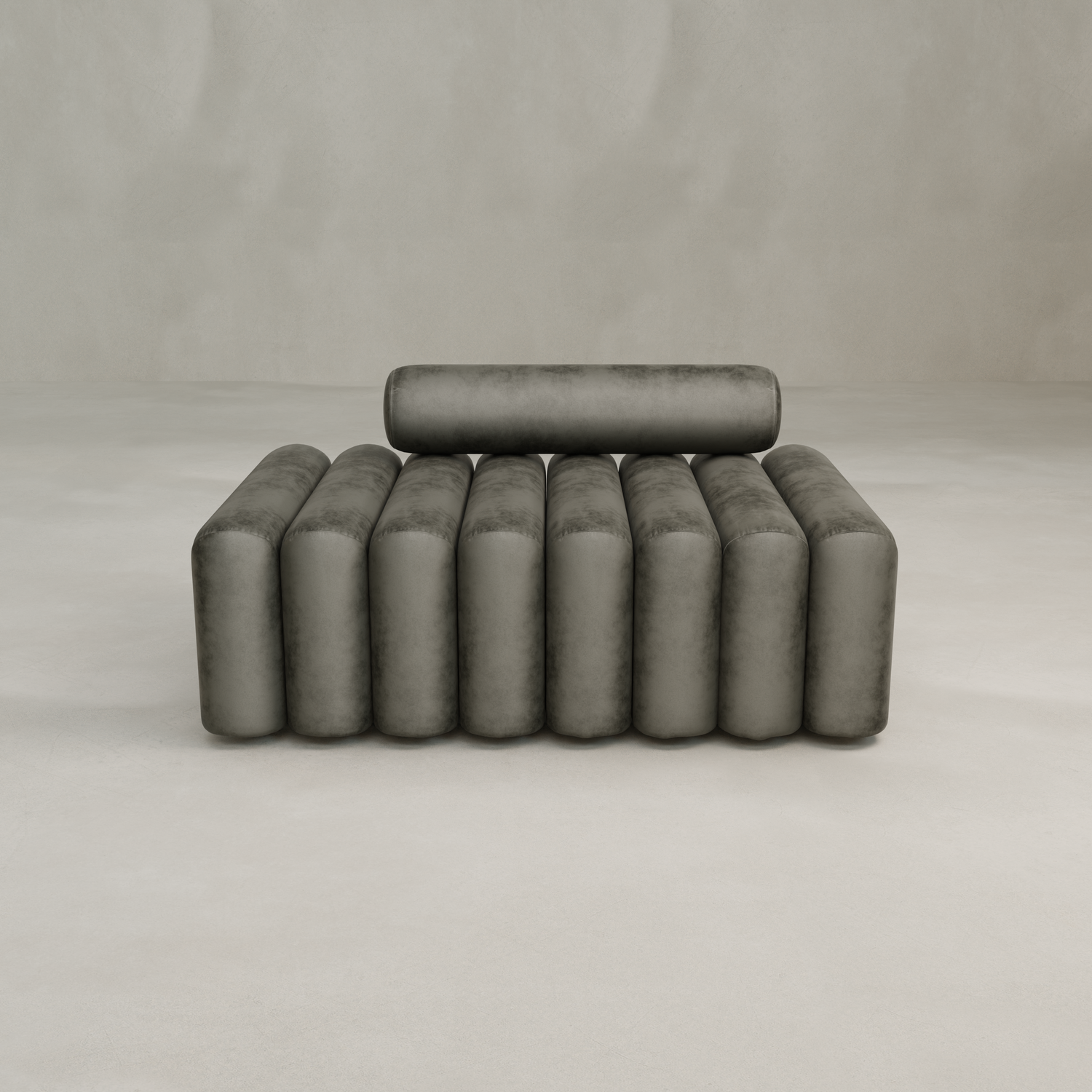 The Sonorra Bench Medium features a modern cylindrical, ribbed design in grayish-green with plush seating and vertical, rounded cushions on the seat, arms, and backrest, set against a plain neutral background.