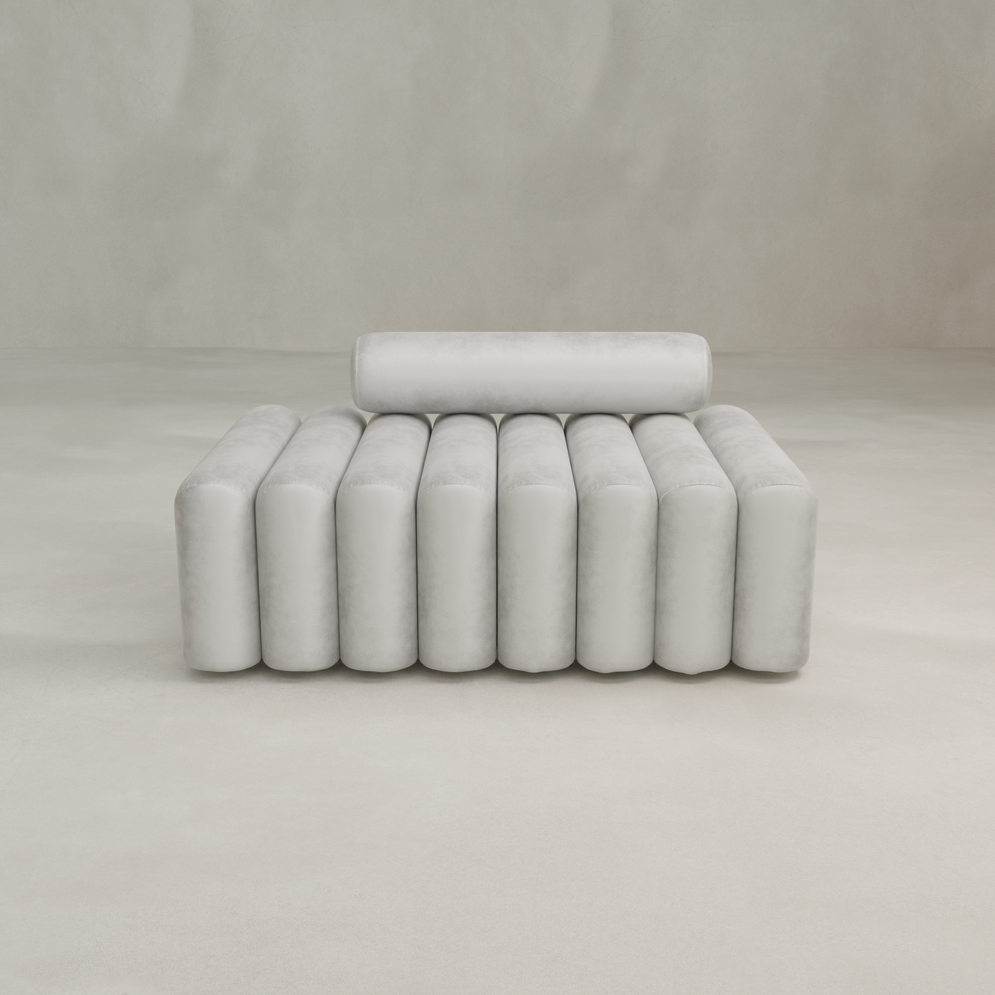 The Sonorra Bench Medium features a modern, minimalist design with cylindrical backrest and seat, plush light gray upholstery, set against a plain light beige background.