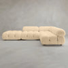 The Belmont Sofa Combination C features a modern, modular cream design with marshmallow-like curves, tufted cushions, and rounded edges, displayed against a plain gray background.