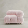 The Belmont Sofa Left Armrest is a modern, plush seat with soft pale pink upholstery, marshmallow-like curves, rounded cushions, and visible button details, pictured against a plain light background.
