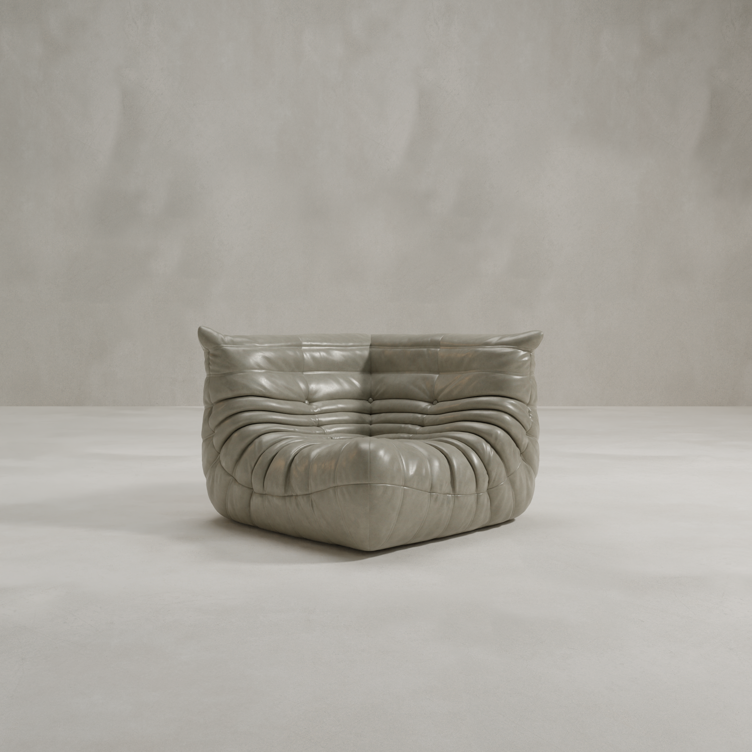 The Rolo Lounge Corner Sofa features a modern, low-profile design in gray leather with deep, plush tufting and a slightly wrinkled texture, reflecting subtle mid-century influences, set against a plain light gray background.