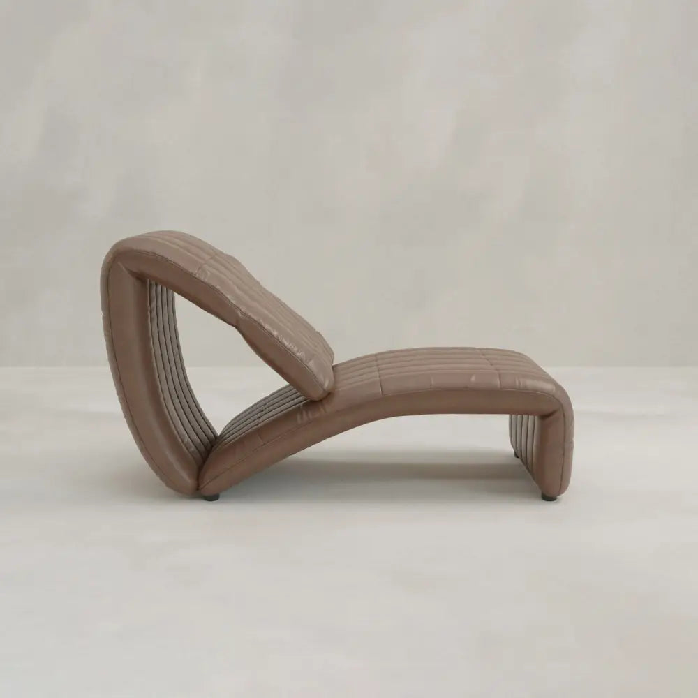 A modern Hillier Chair in brown, S-shaped design with horizontal stitching and premium vintage leather, shown on a plain light background.