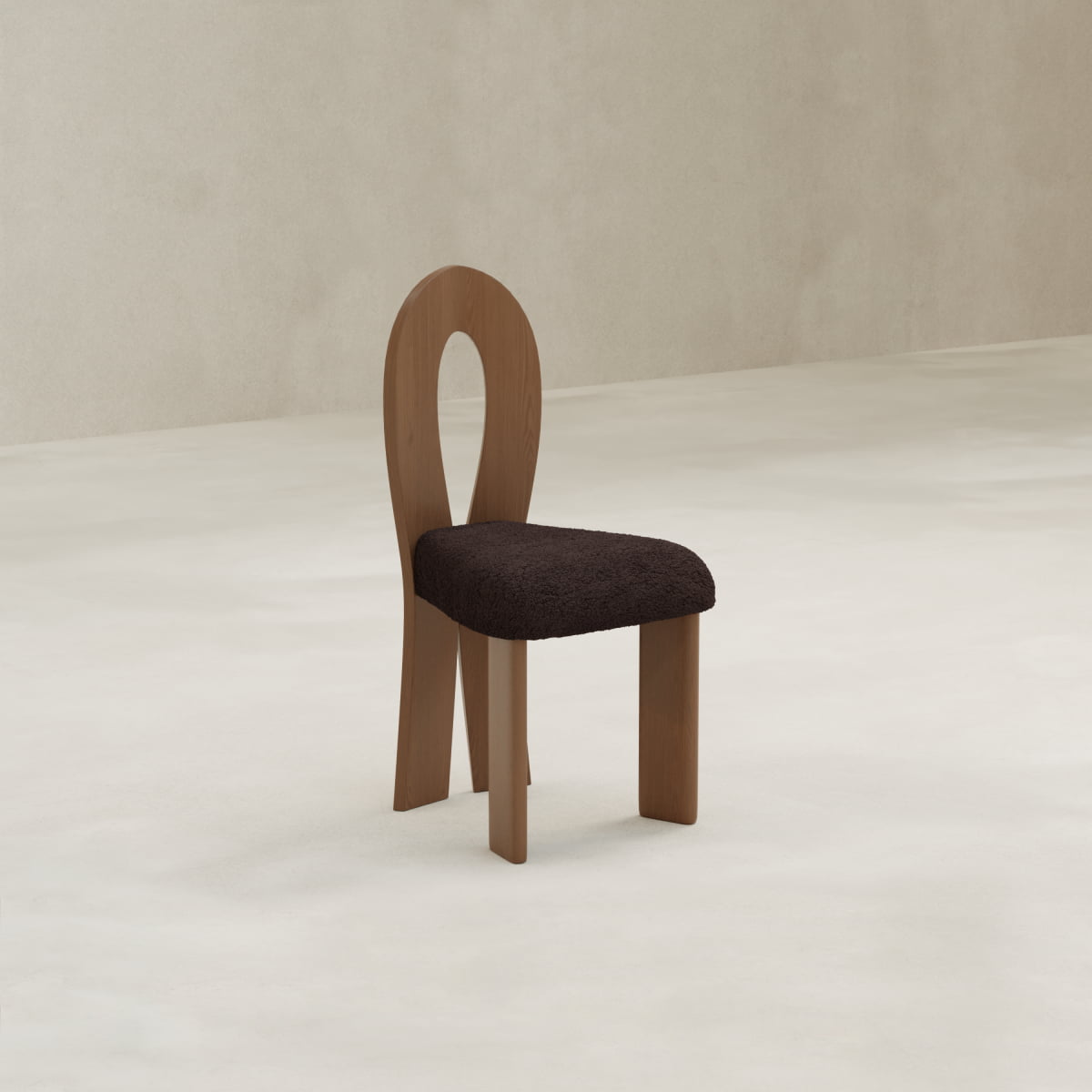 The Aveline Dining Chair, featuring a teardrop backrest and textured dark upholstery, sits on a light minimalist floor with a beige wall background.