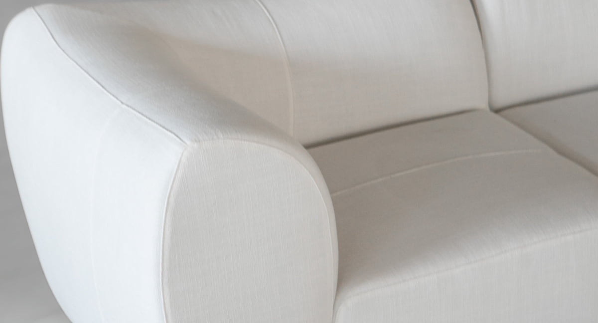 Close-up view of the Bambon 3 Piece Sofa Set—a modern, white upholstered sofa with rounded armrests and smooth fabric texture, perfectly designed for contemporary living.