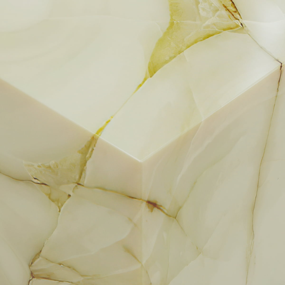 A close-up of the Blanchaire Onyx Plinth - Tall shows a sharp corner, creamy beige tones, delicate veining, and natural brownish-yellow streaks on its luminous finish.