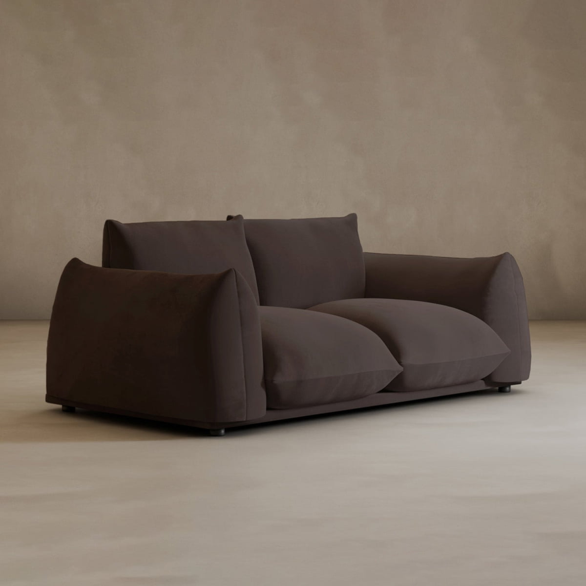 The dark brown Calypso Loveseat offers modern elegance with plush cushions and wide armrests, perfectly complementing a minimalist room with beige walls and a light floor.