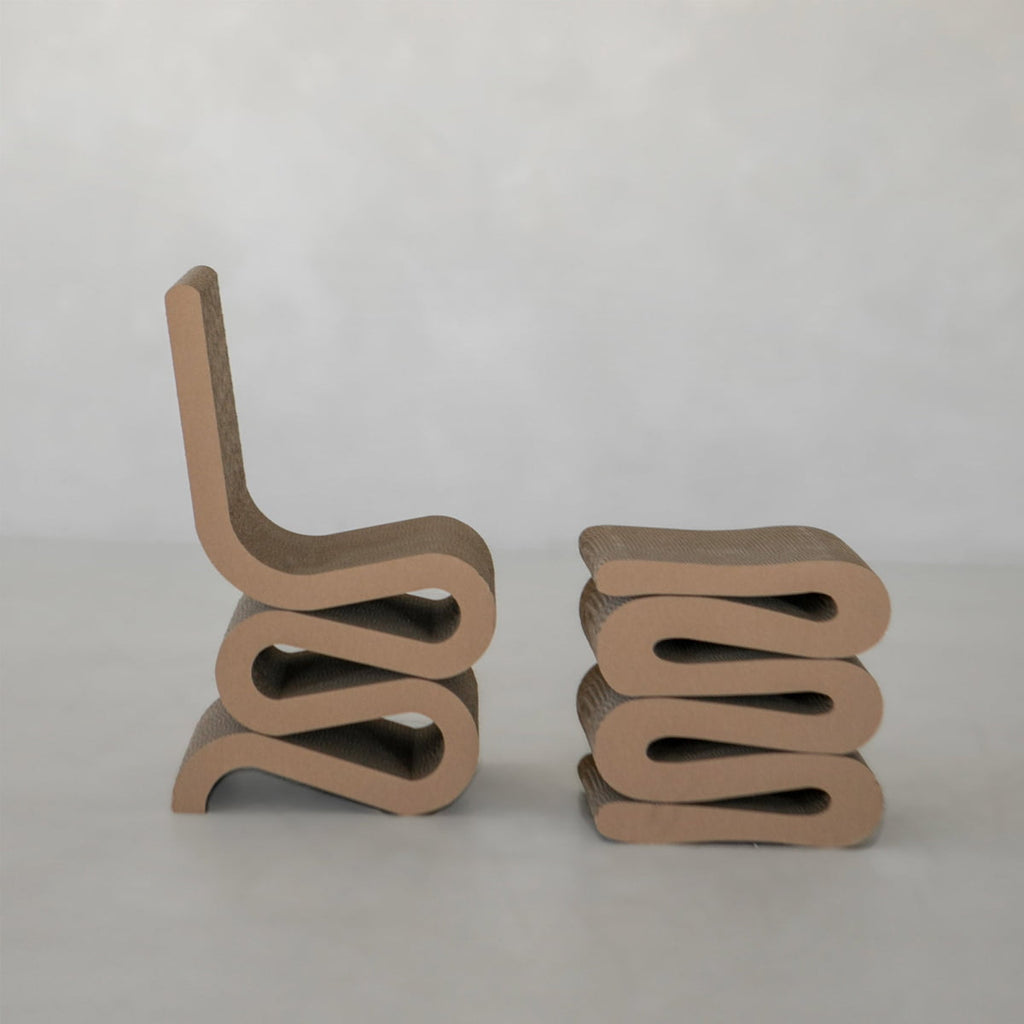 Two Curly Wurly Chairs made of layered, wavy-cut cardboard are shown side by side. The left features a backrest as a full chair, while the right shows only the chair base without a backrest.