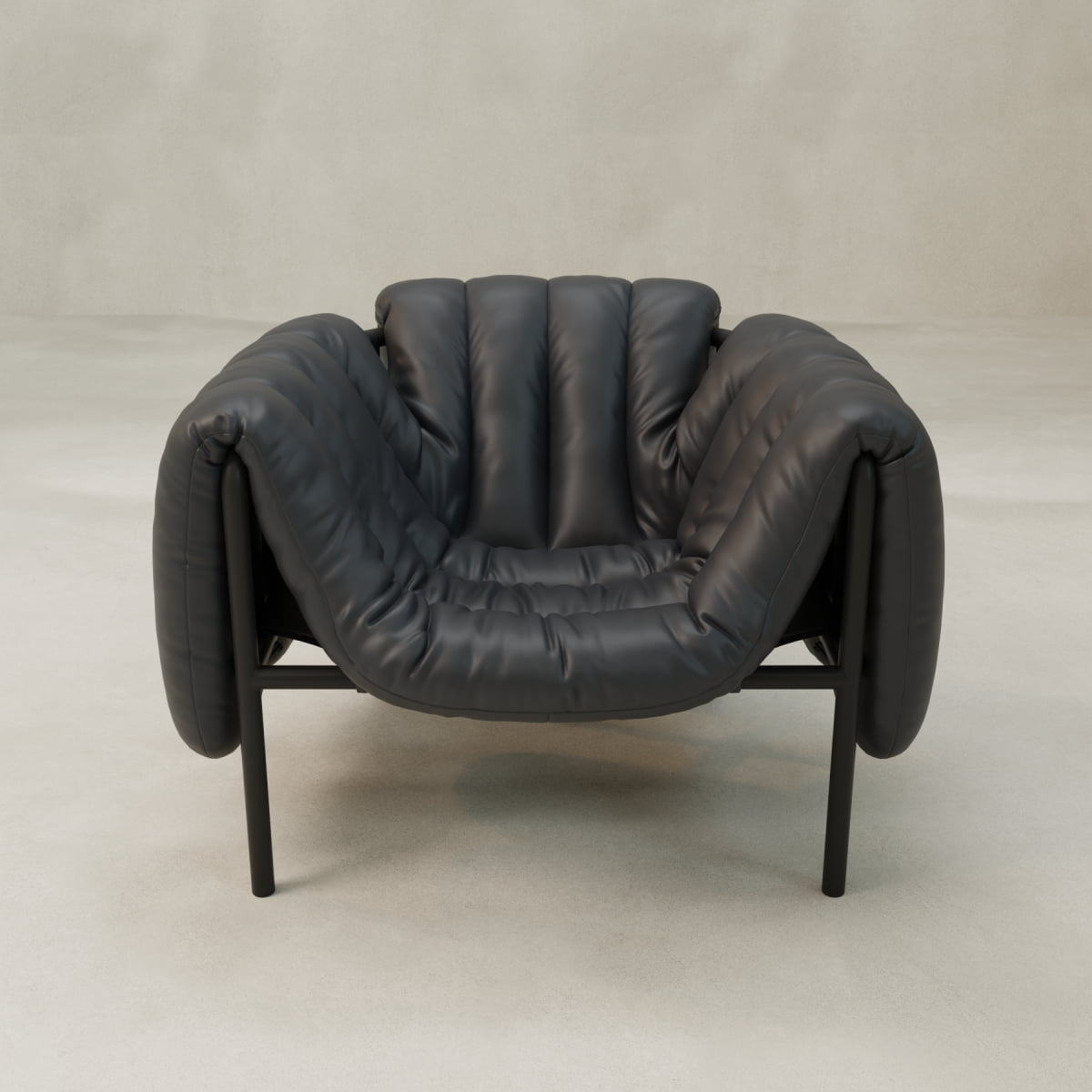 The Mallow Chair features plush black leather upholstery, segmented cushioning, and deep channeled tufting. Set on slim black legs, it stands out against a neutral background and light floor for a stylish, cozy look.