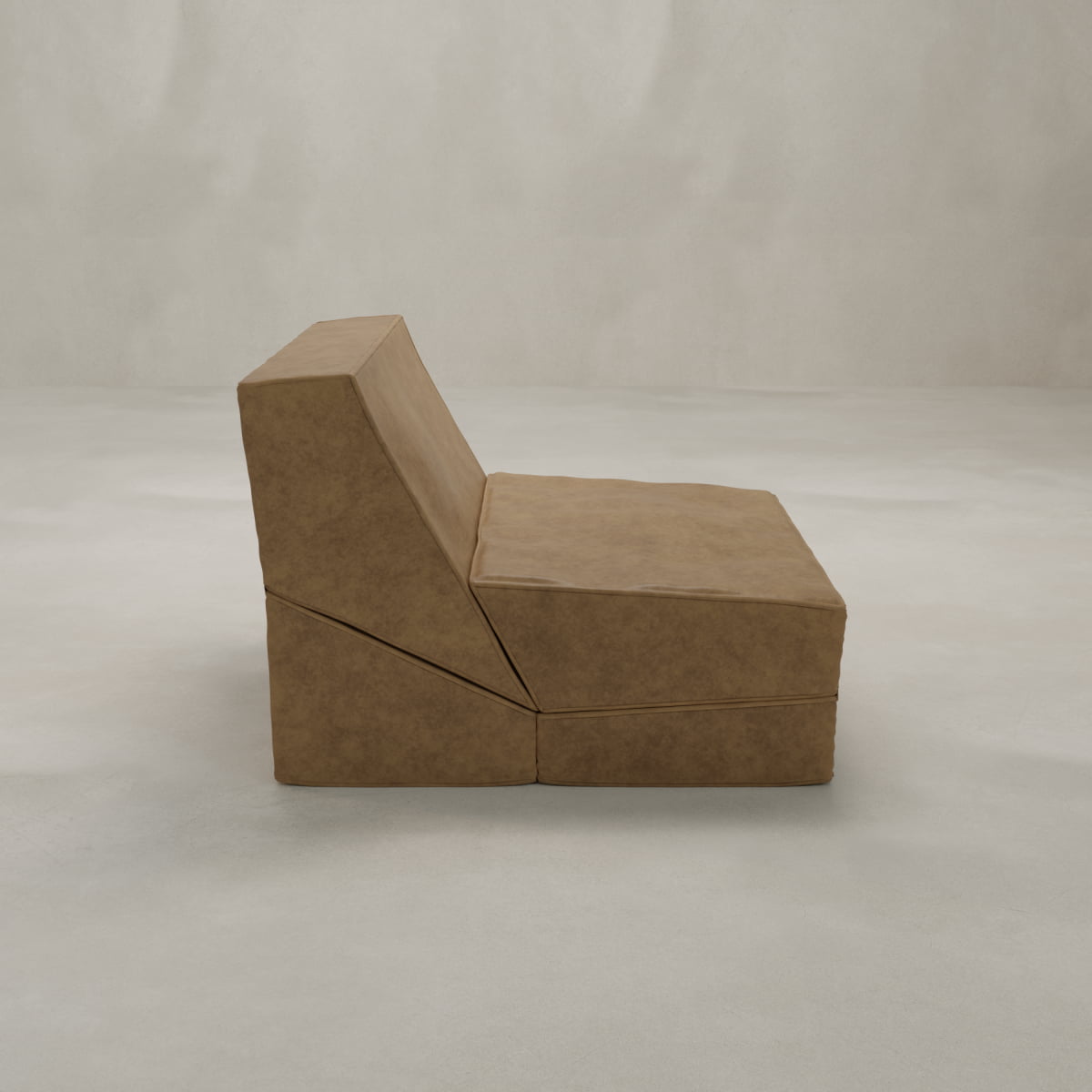The Meazza Lounge Chair, shown in profile against a light background, features tan suede-like upholstery, geometric lines, and a low, wide seat—bringing modern elegance and minimalist style to any contemporary space.