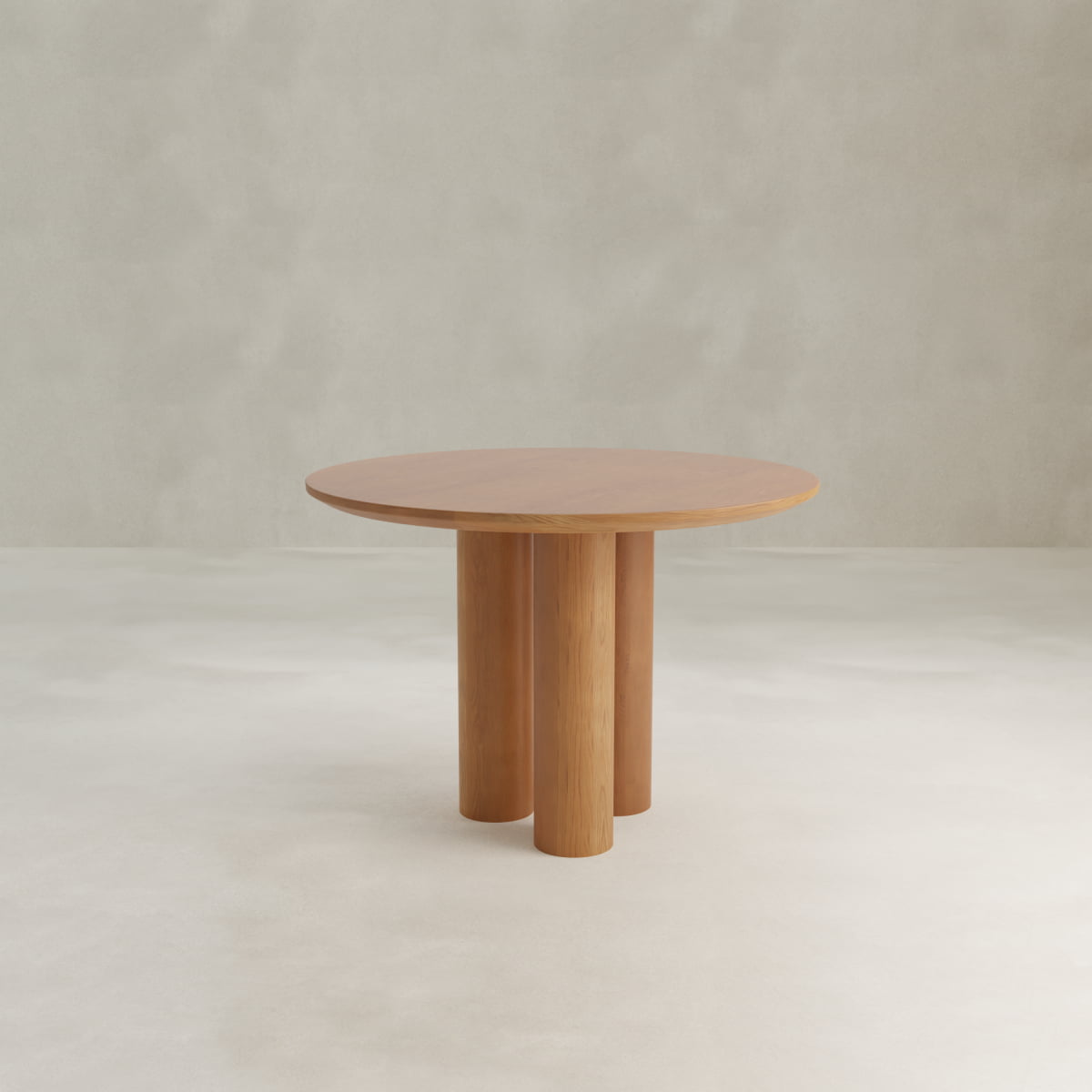 The Milo Large Wood Dining Table features a smooth, round wooden top with three cylindrical legs, showcased against a light background—an ideal choice for bringing modern style to compact spaces.