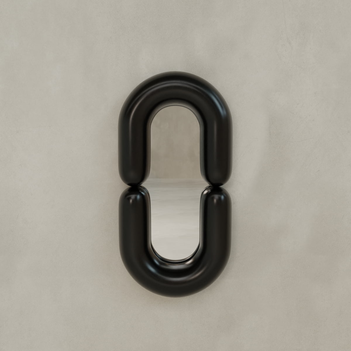 The Pitti Mirror Large In Black features a modern round design with an artistic touch, mounted on a light beige wall and framed by bold, glossy black curved segments at the top and bottom for striking geometric appeal.