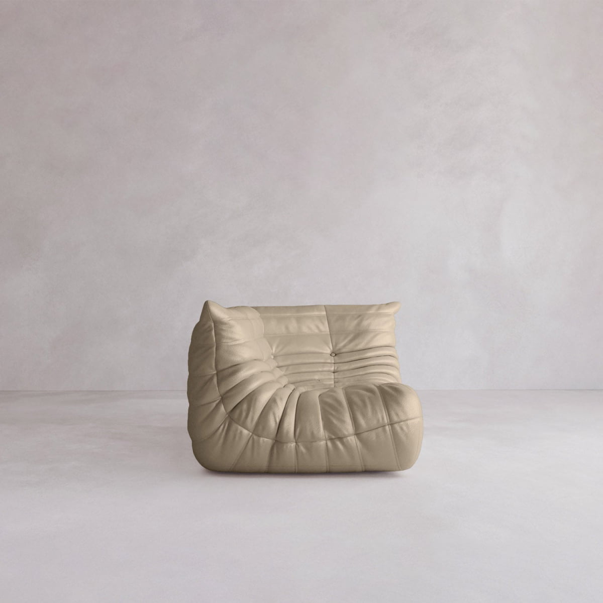 The Rolo Lounge Corner Sofa, a beige modern armless piece with plush ruched upholstery, brings 70s-inspired style to any minimalist room with its soft comfort and retro design.