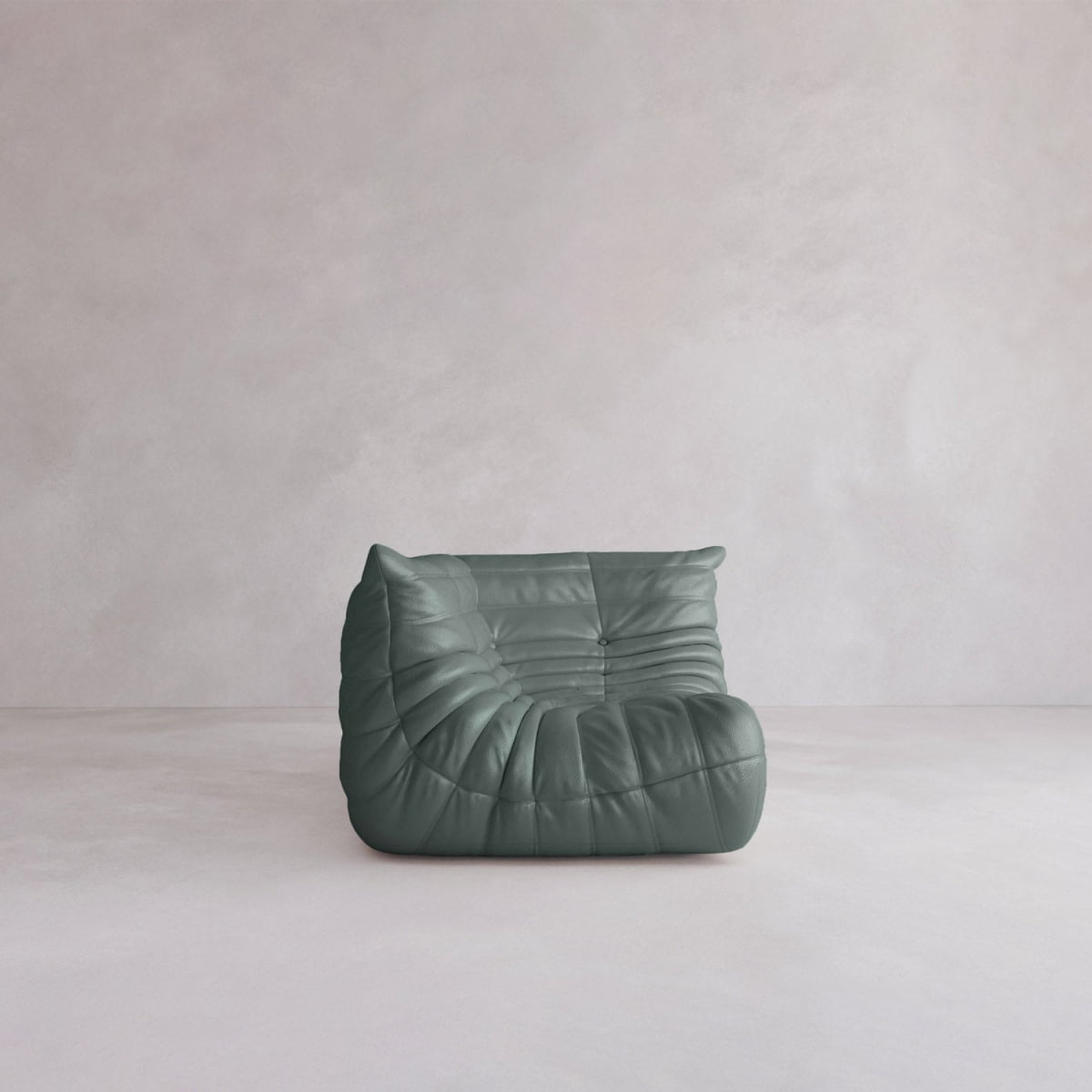 The Rolo Lounge Corner Sofa features a modern, armless design with dark green tufted leather upholstery, highlighting mid-century style on a light minimalistic floor against a pale wall.