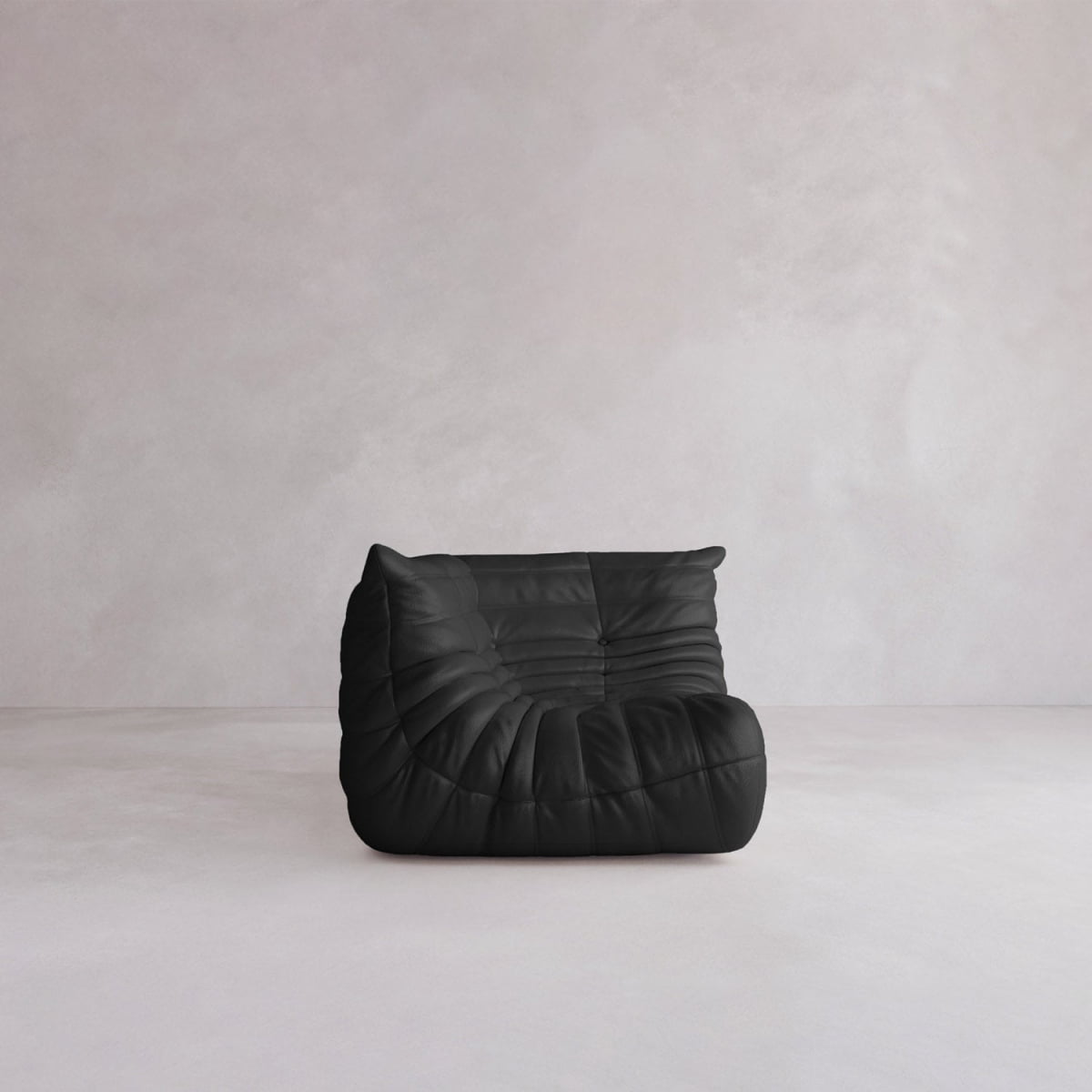 The Rolo Lounge Corner Sofa, featuring a sleek black, armless 70s-inspired tufted design, rests on a light minimalist floor by a pale textured wall.