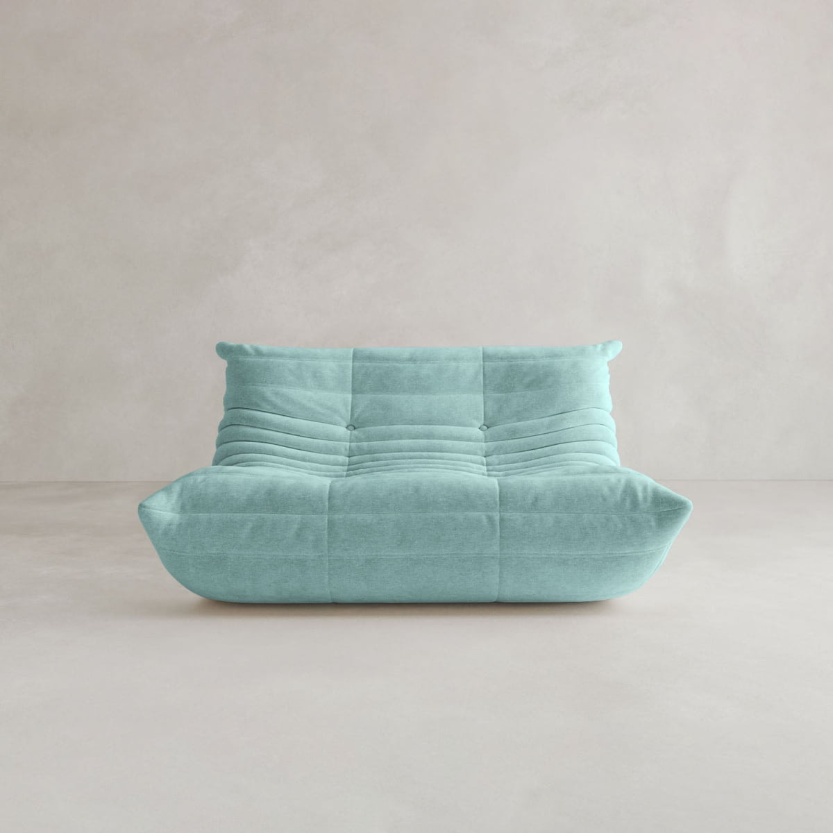 The Rolo Lounge Loveseat, a modern light turquoise armless sofa with a quilted, tufted design and mid-century influence, is shown against a plain light beige background.