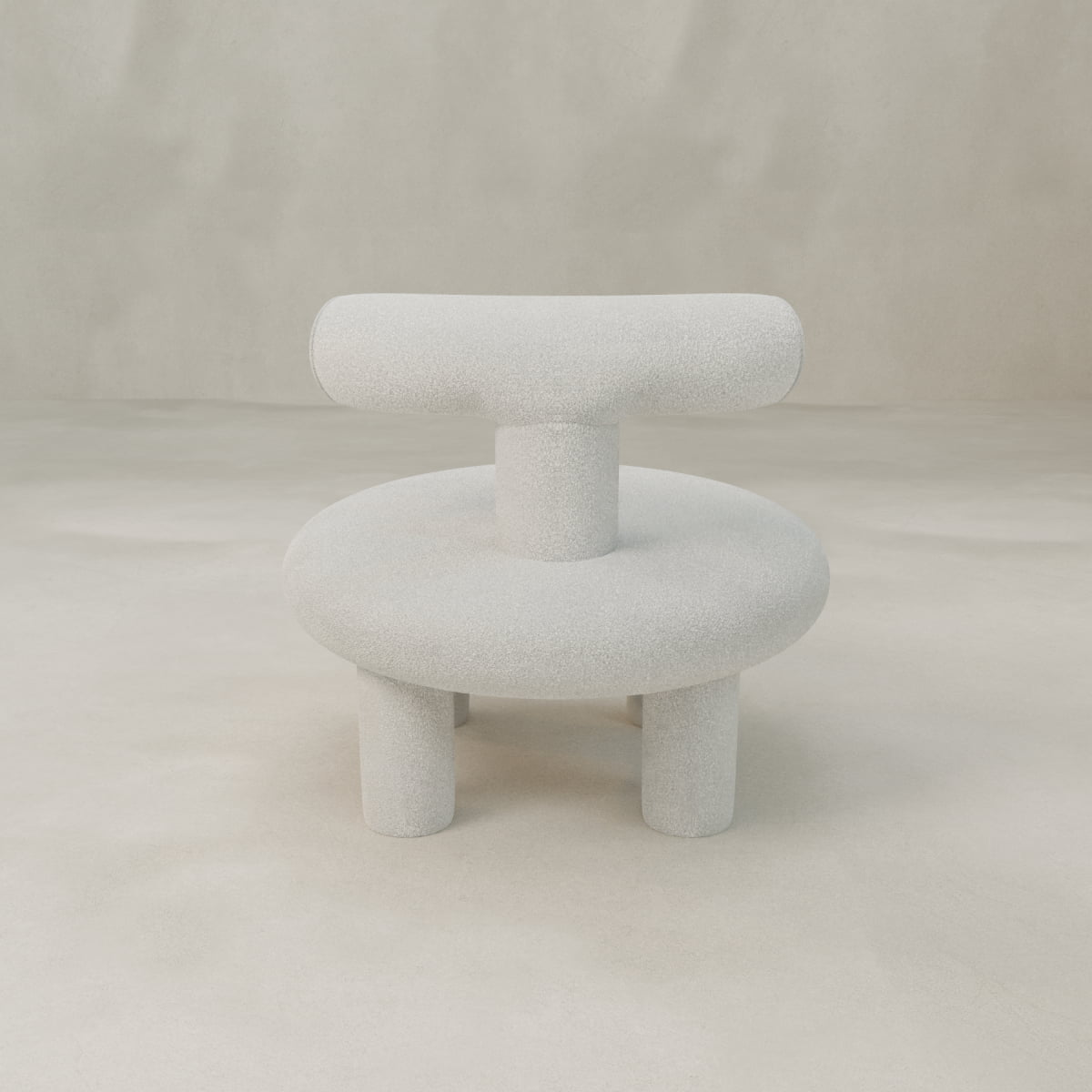 The Teddy Chair features a modern neotenic design with textured light gray fabric, thick rounded seat, cylindrical legs, and a wide backrest—perfect as a minimalist statement piece against a beige background.
