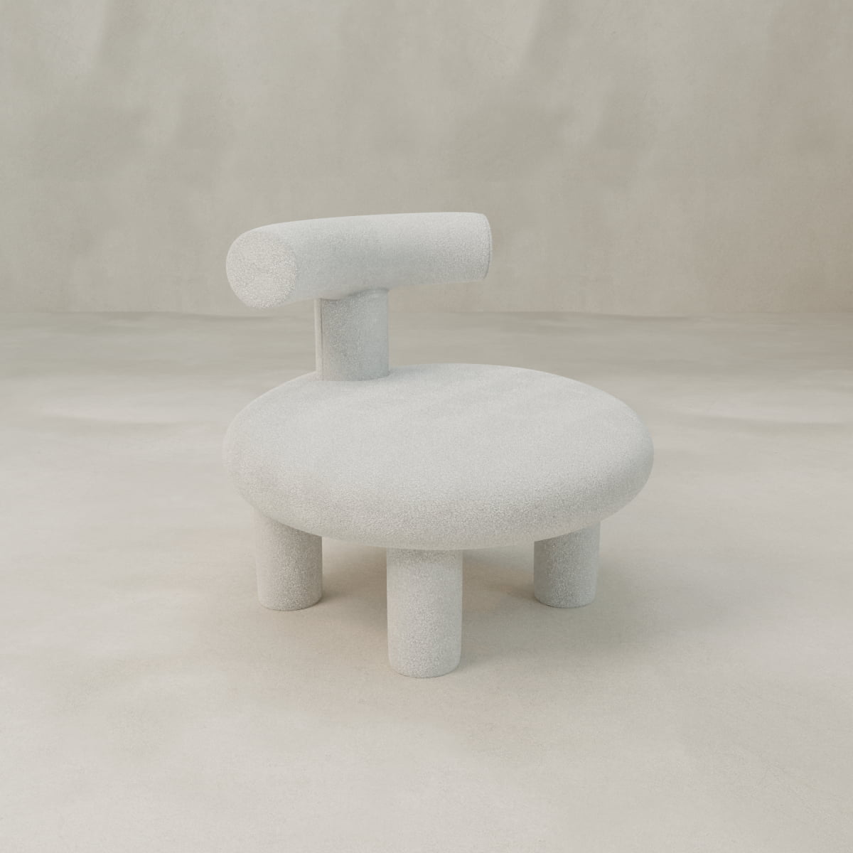 The Teddy Chair features a round cushioned seat, four cylindrical legs, and a short backrest, all upholstered in light gray textured fabric—a modern, minimal statement piece that exudes luxury against any neutral backdrop.